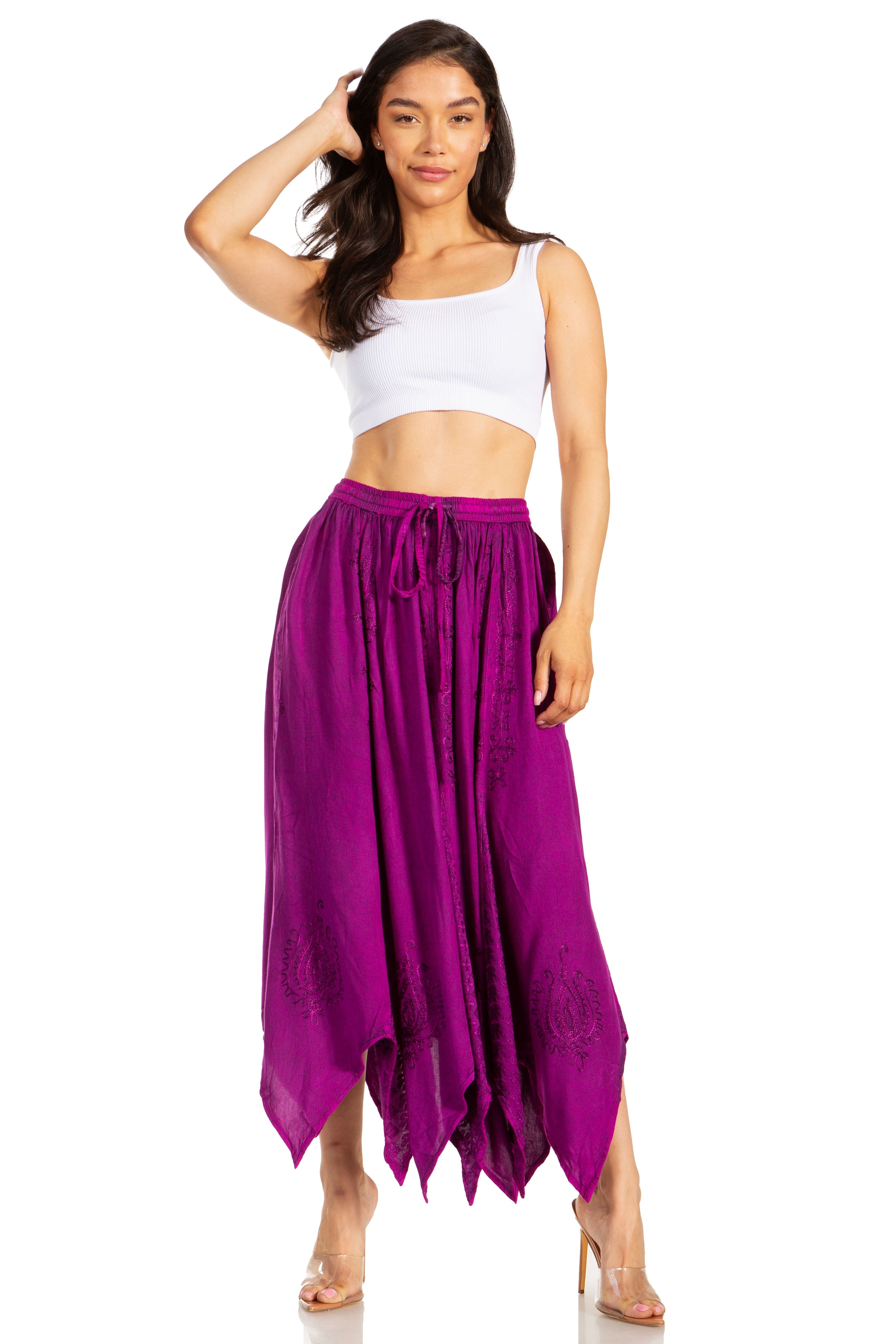 Woman wearing a white top and purple skirt on a white background