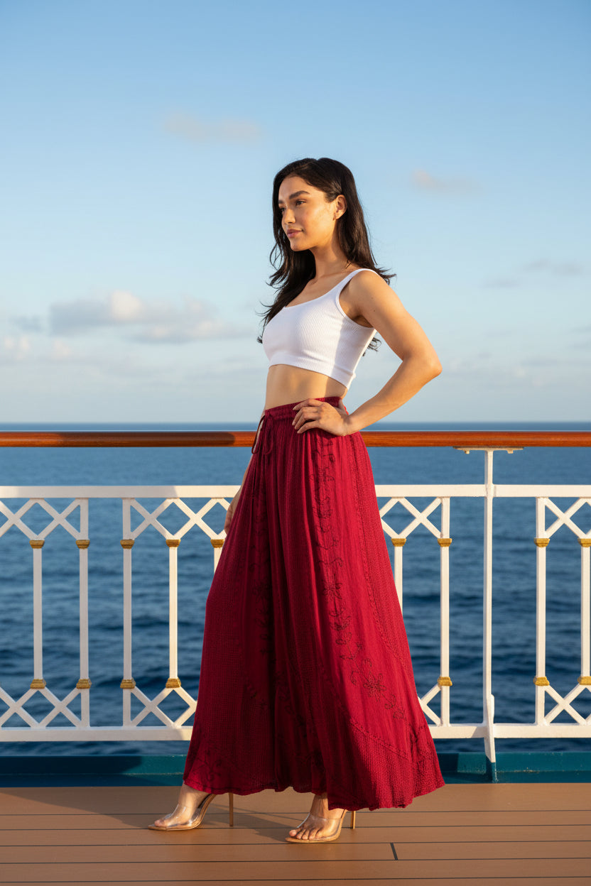 Woman wearing a white top and red skirt on a white background
