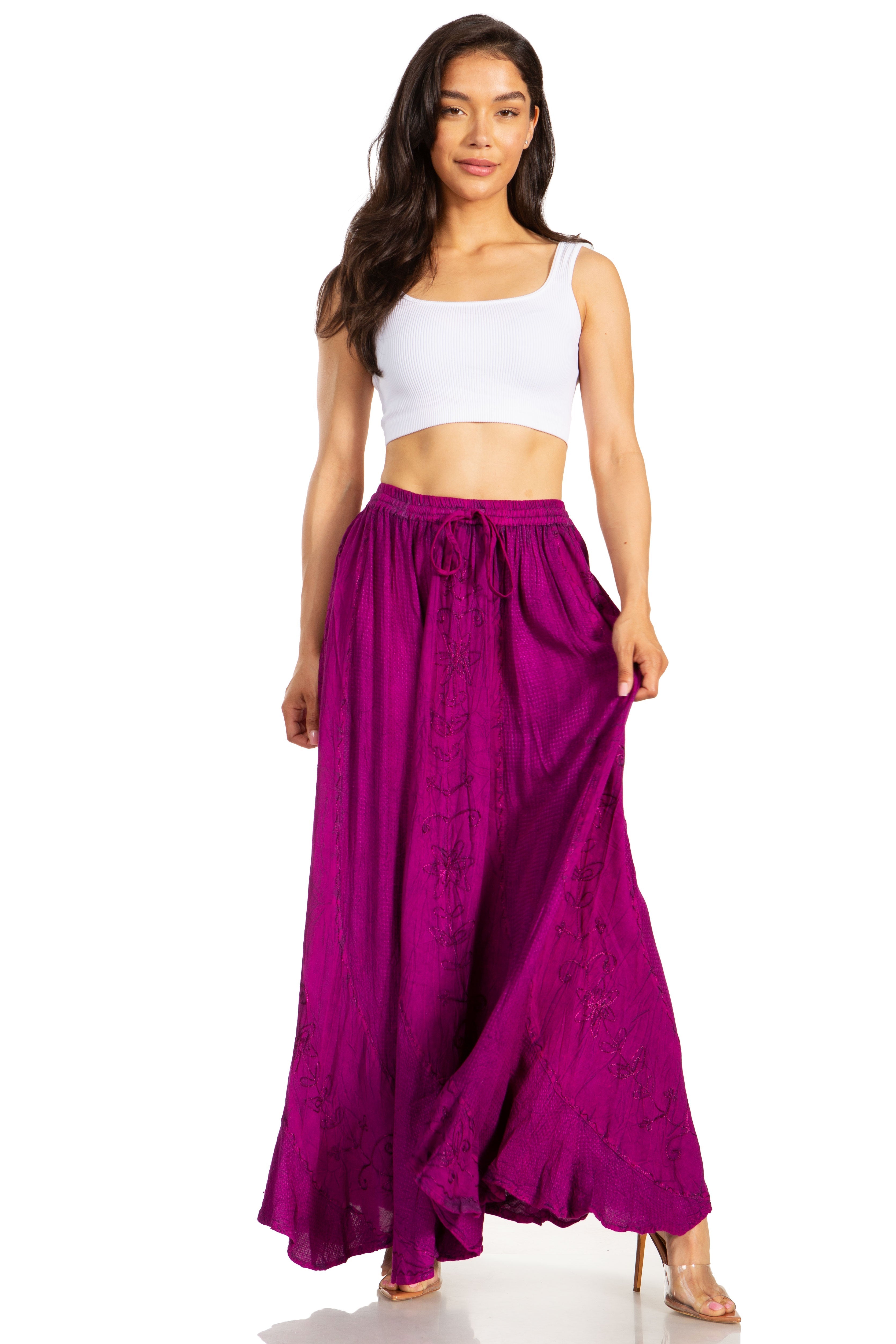 Woman wearing a white top and purple skirt on a white background
