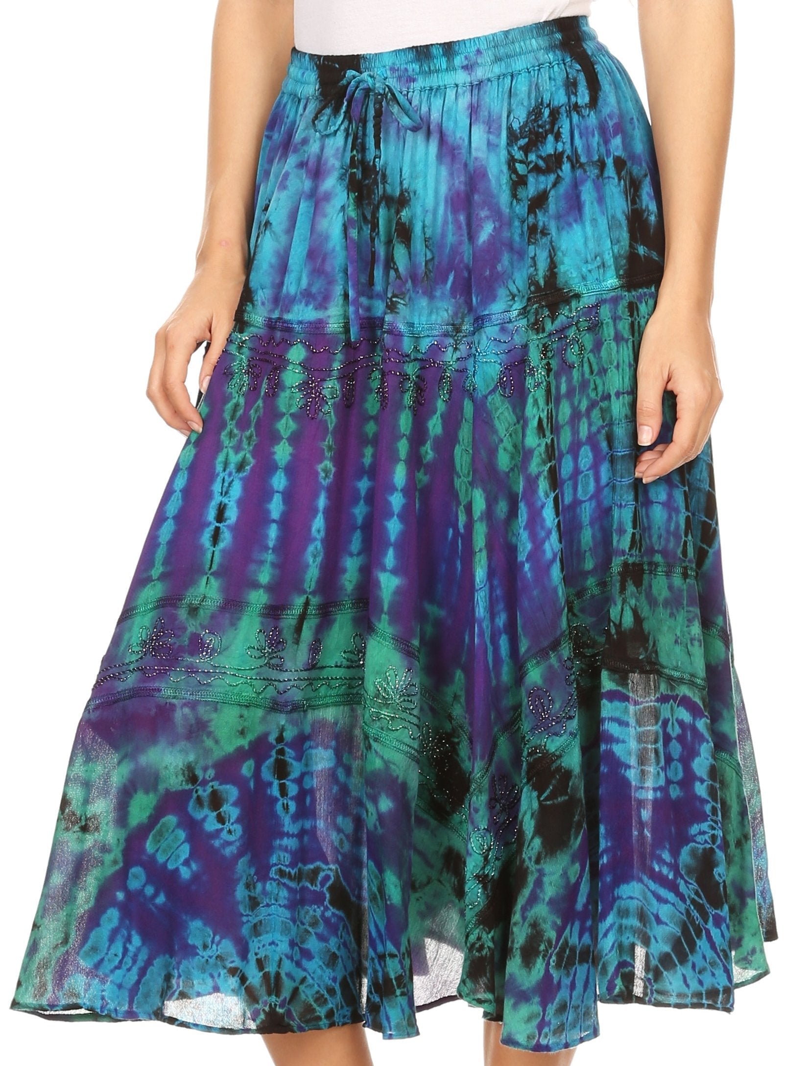 Multicolored tie-dye skirt worn by a person on a white background