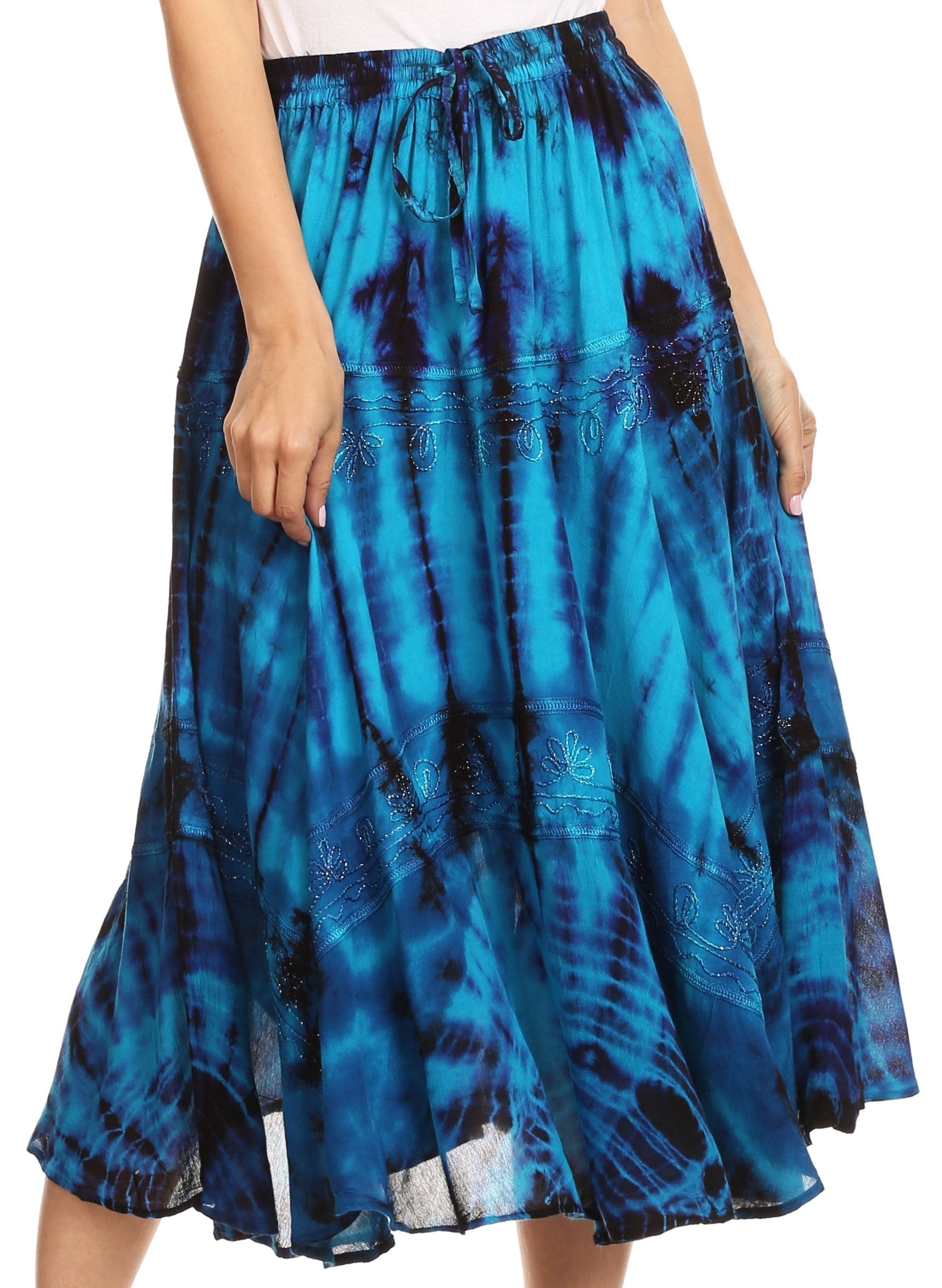 Blue tie-dye skirt worn by a person on a white background