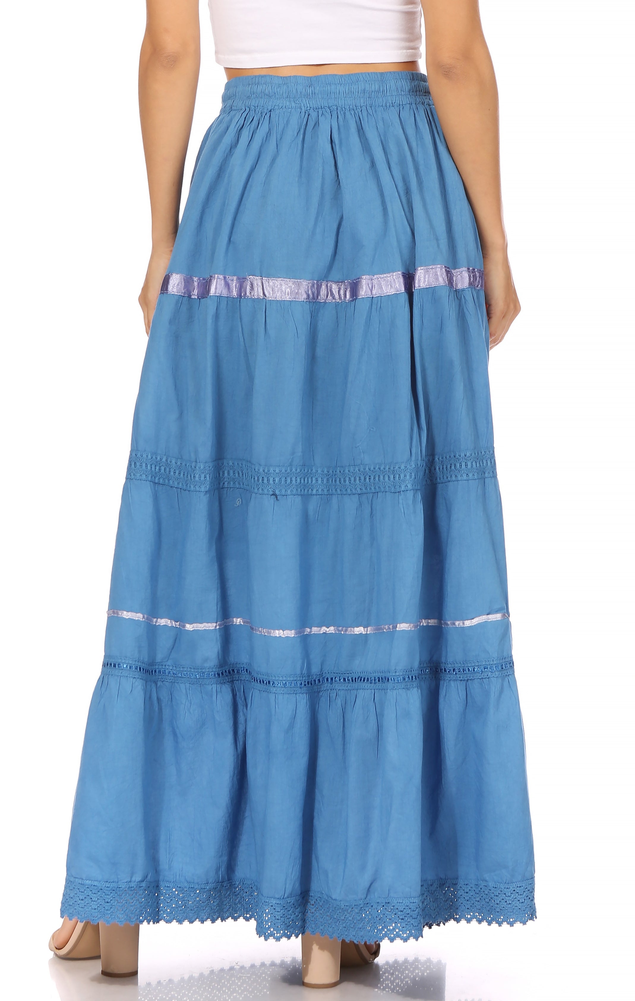 Blue tiered skirt with white trim worn by a person on a white background