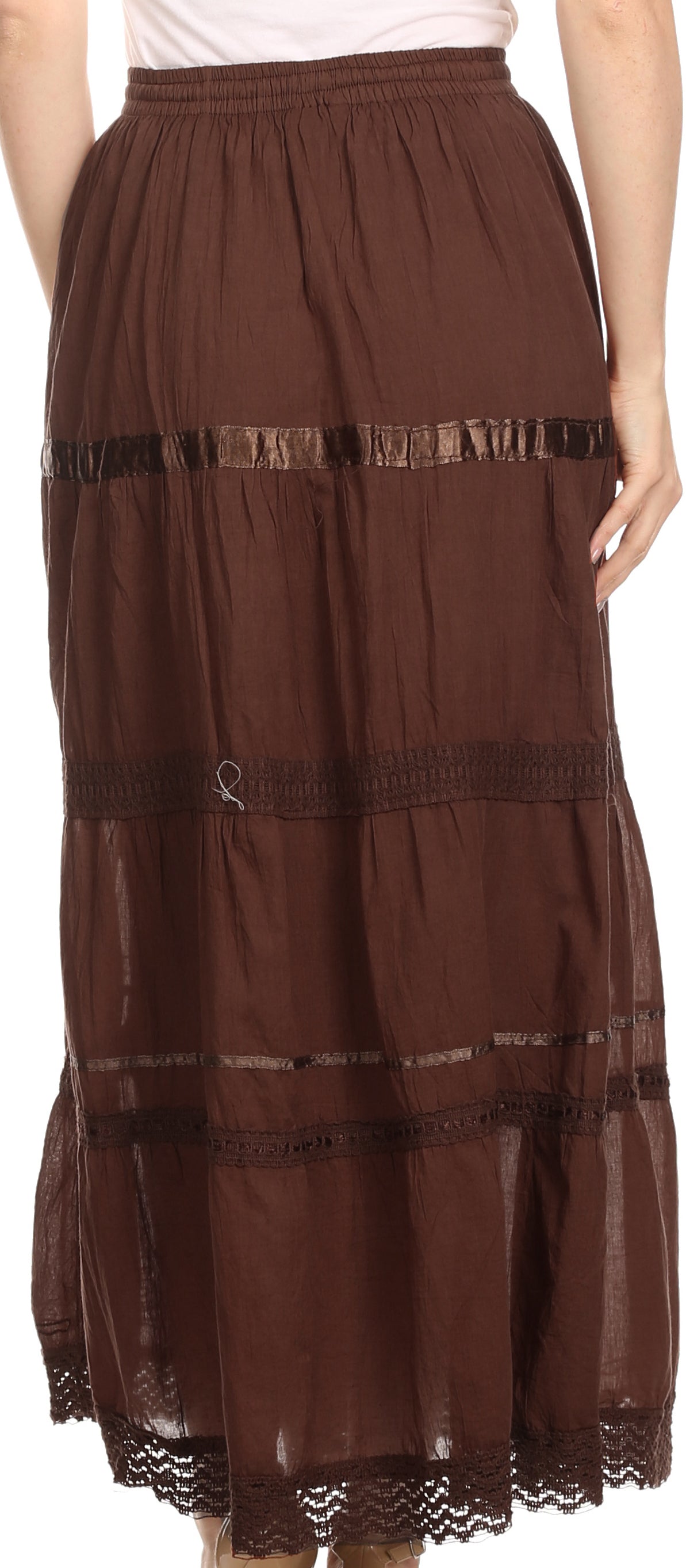 Brown tiered skirt with lace trim worn by a person