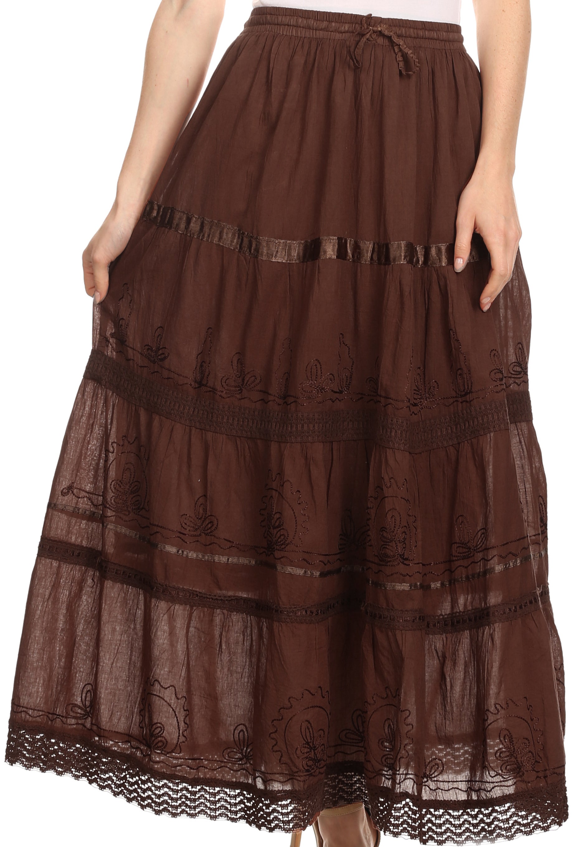 Brown lace skirt worn by a person on a white background