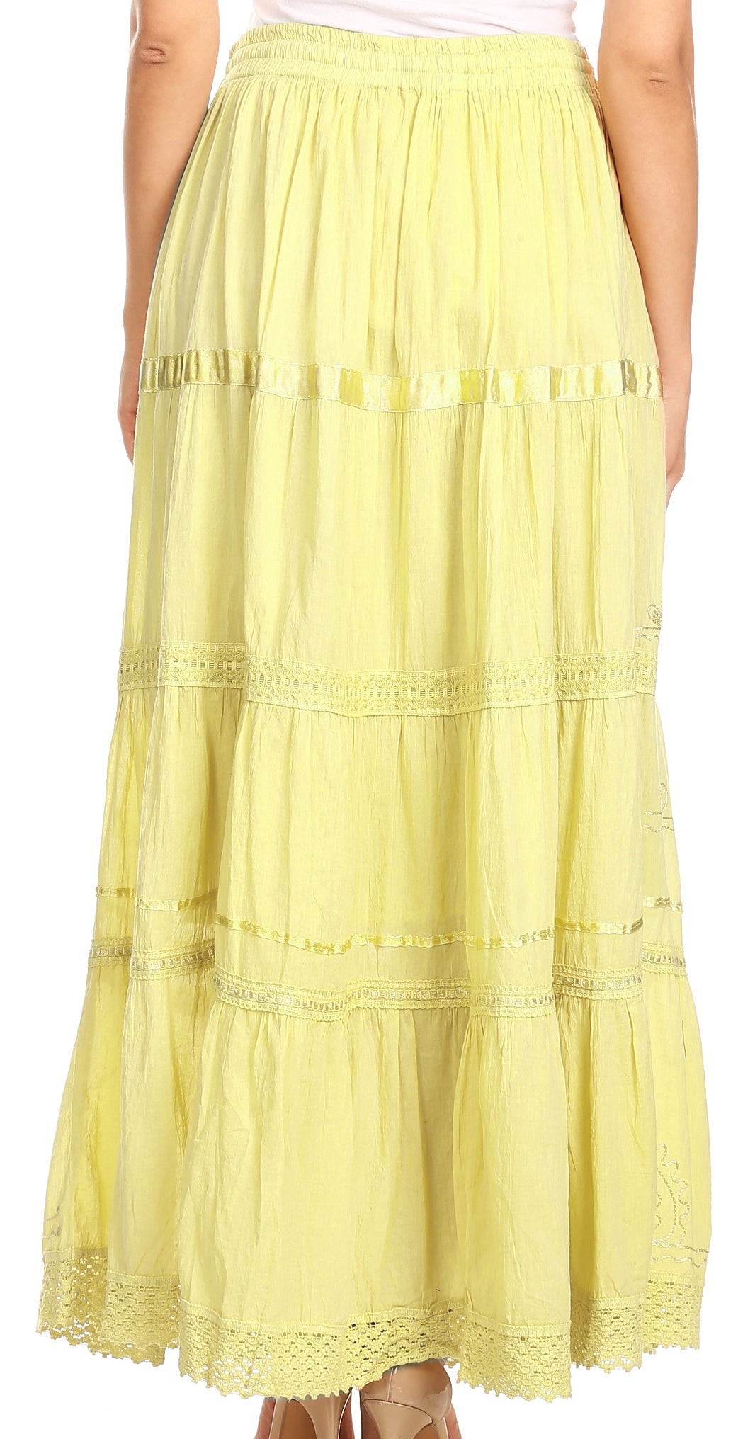 Yellow tiered skirt worn by a person on a white background