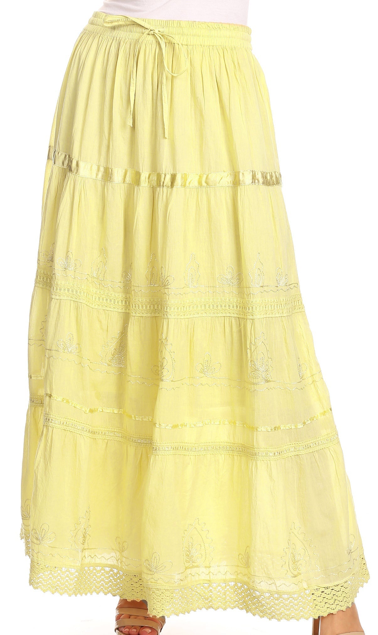 Yellow tiered skirt with lace details on a white background