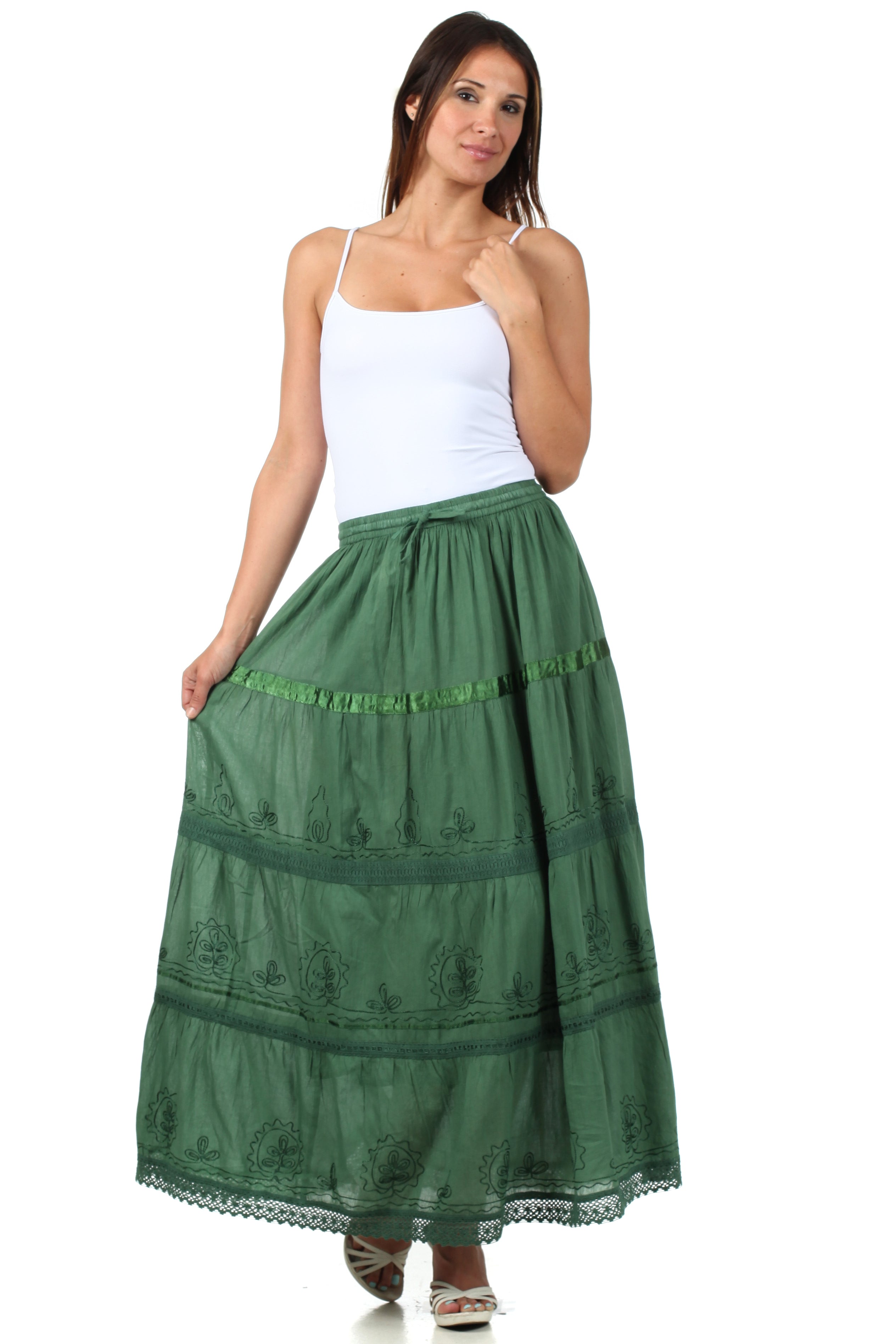 Woman wearing a green skirt with a white top on a white background
