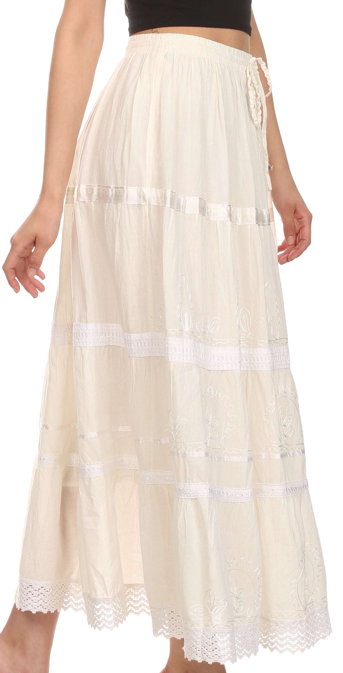 Beige lace-trimmed skirt worn by a person on a white background