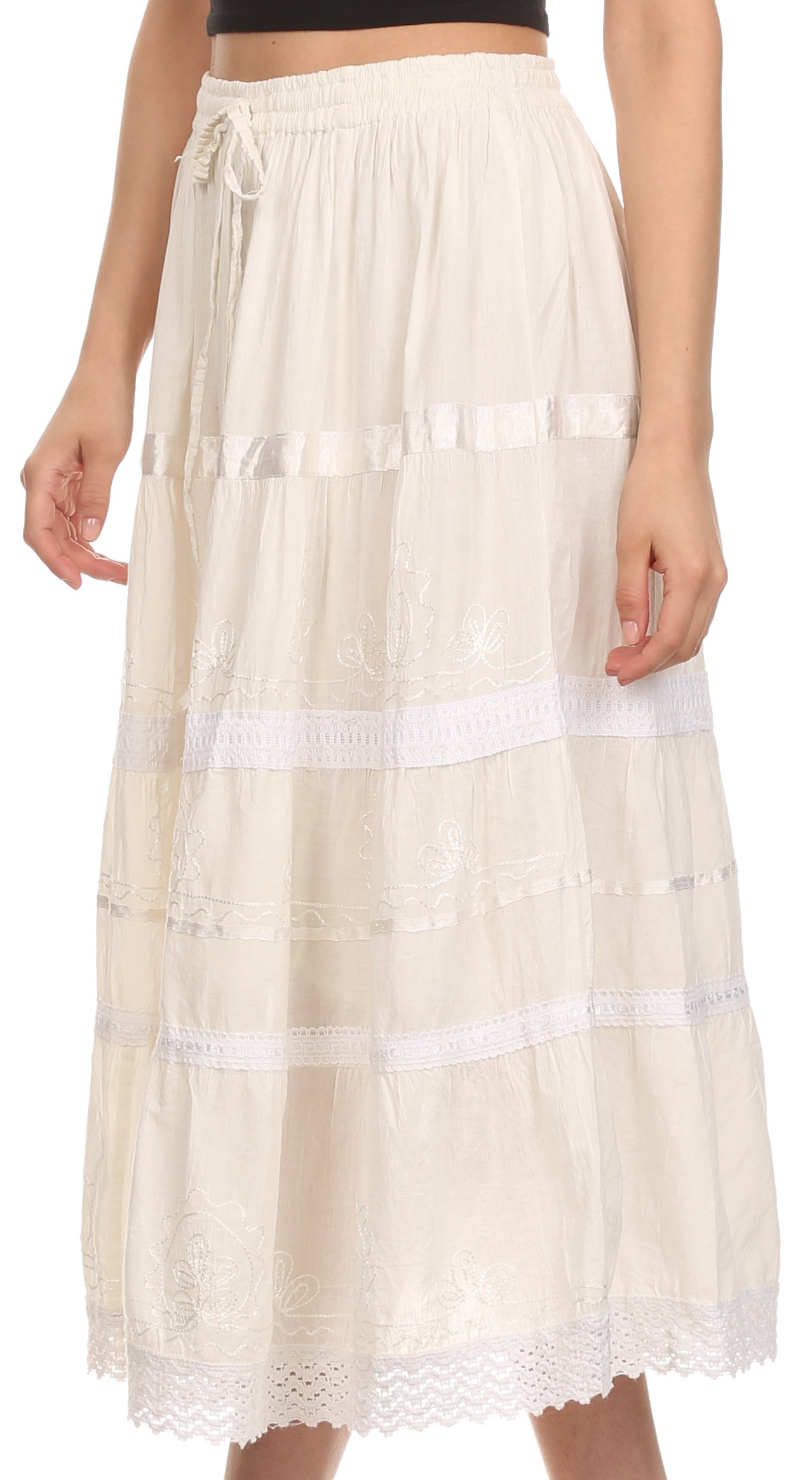 Beige skirt with lace details worn by a person on a white background