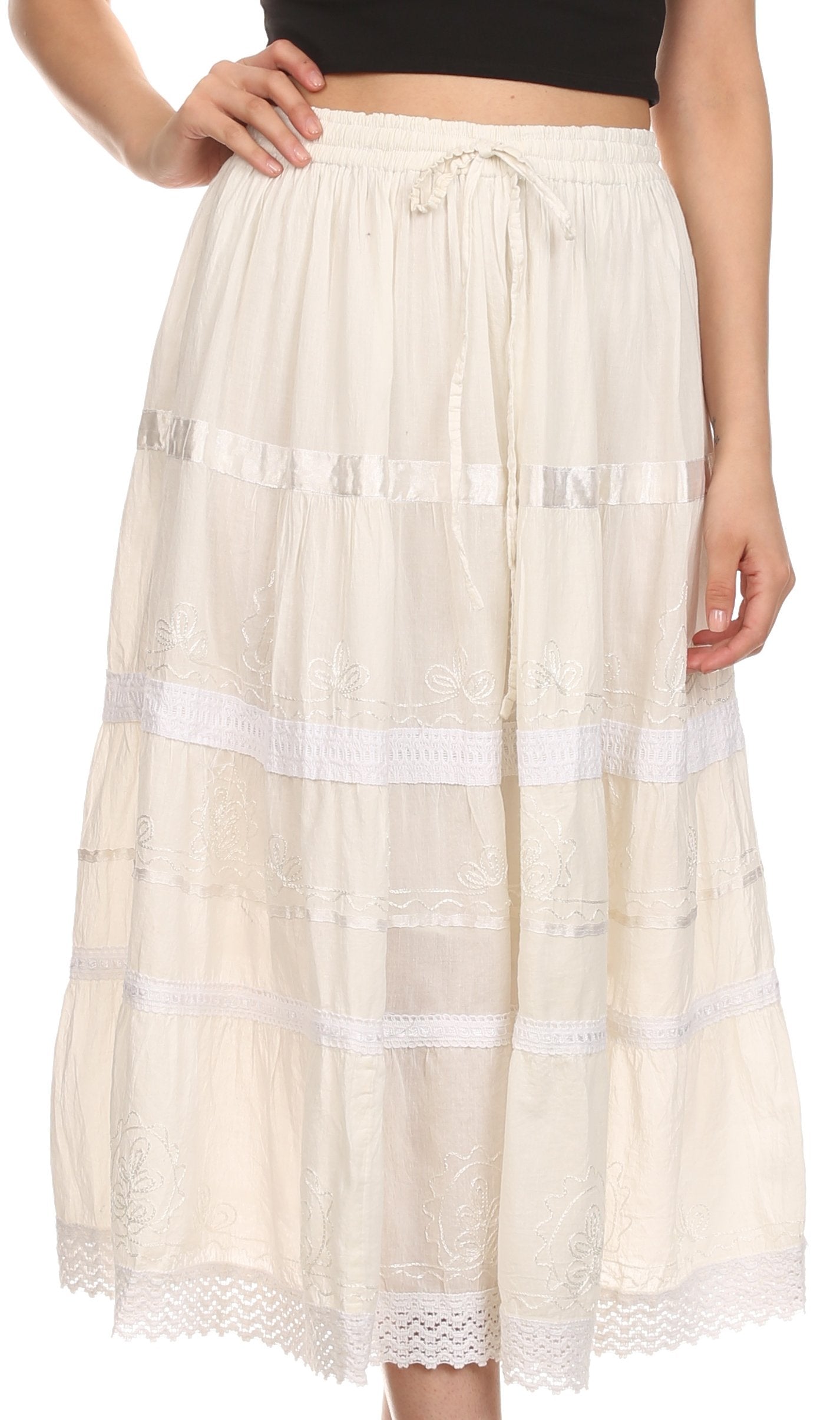 Beige lace skirt with white ribbons worn by a person on a white background