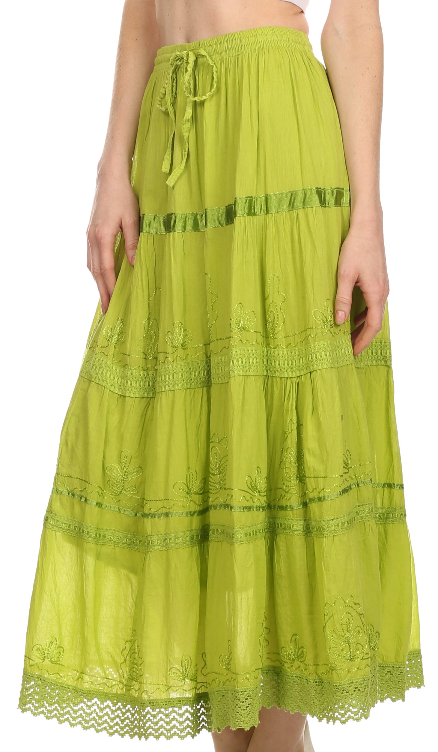 Green lace skirt worn by a person on a white background