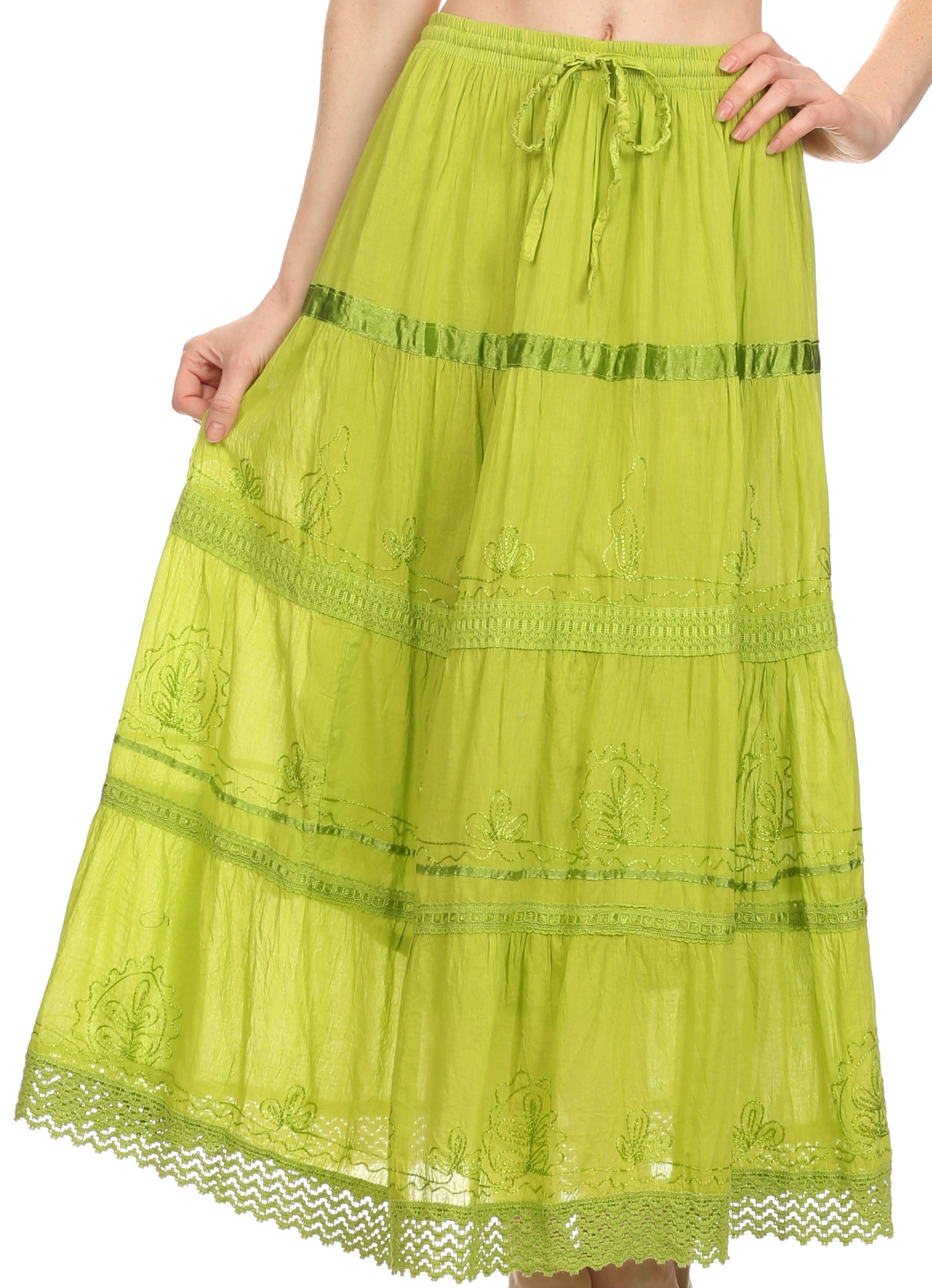 Green lace skirt worn by a person on a white background