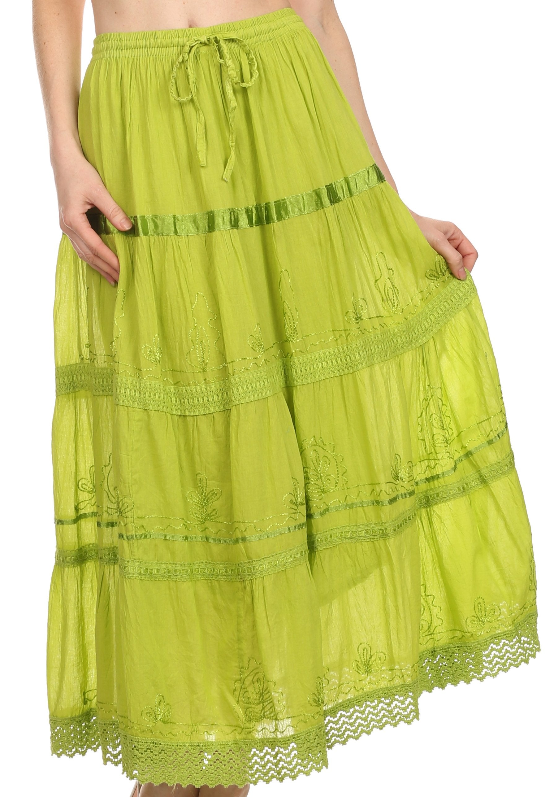 Green lace skirt worn by a person on a white background