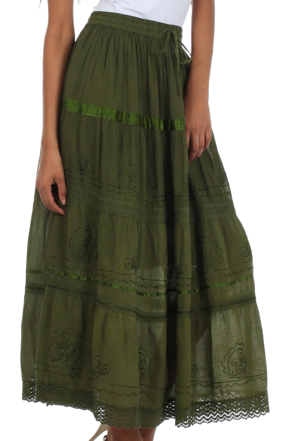 Green embroidered skirt worn by a person on a white background