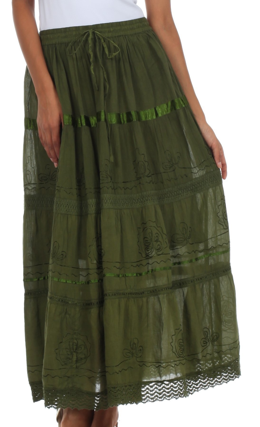 Green embroidered skirt worn by a person on a white background