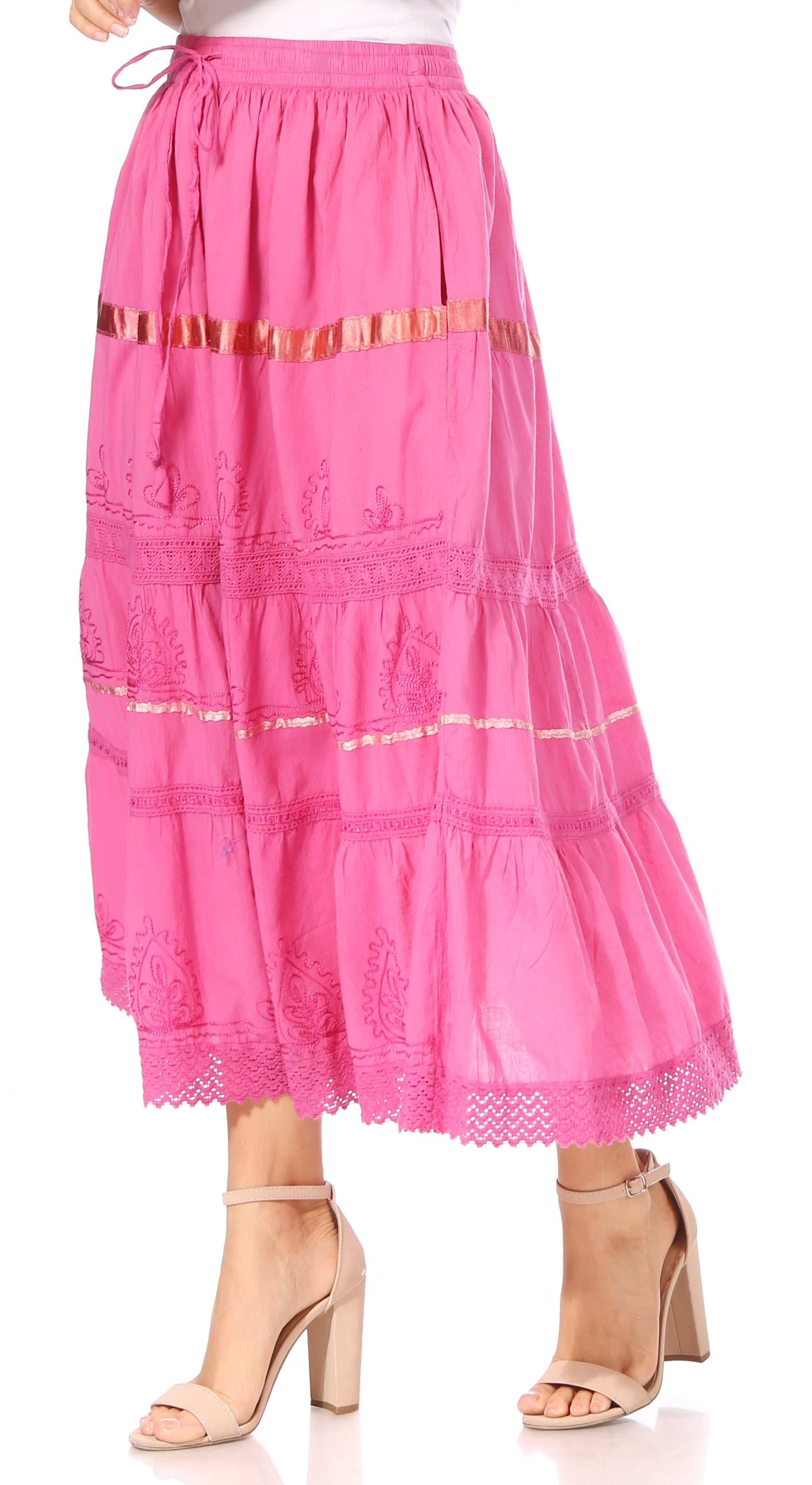 Pink tiered skirt with gold accents on a white background