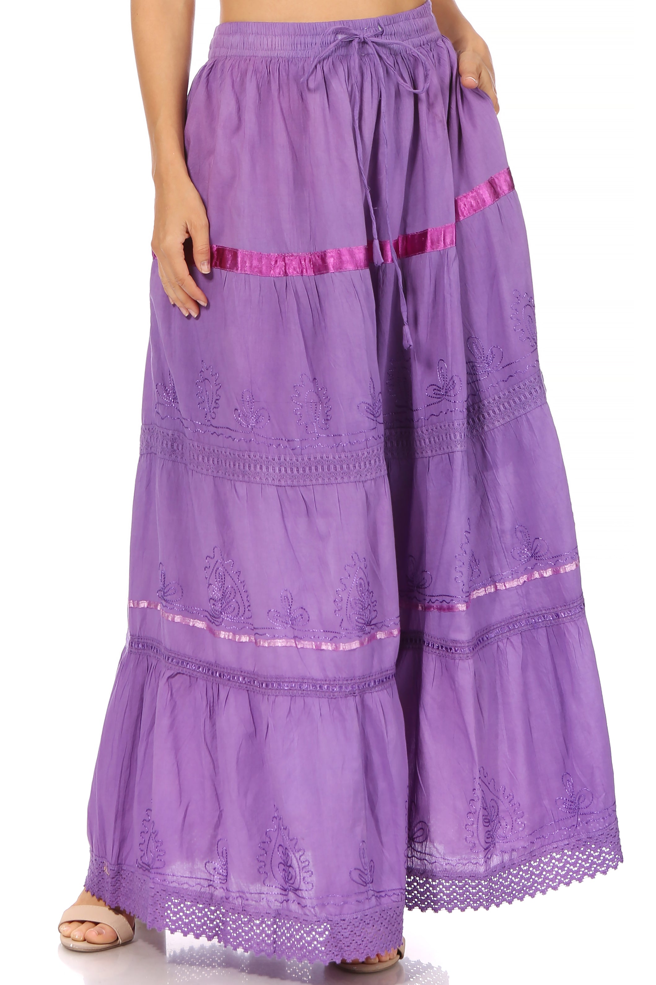 Purple embroidered skirt with pink accents on a white background