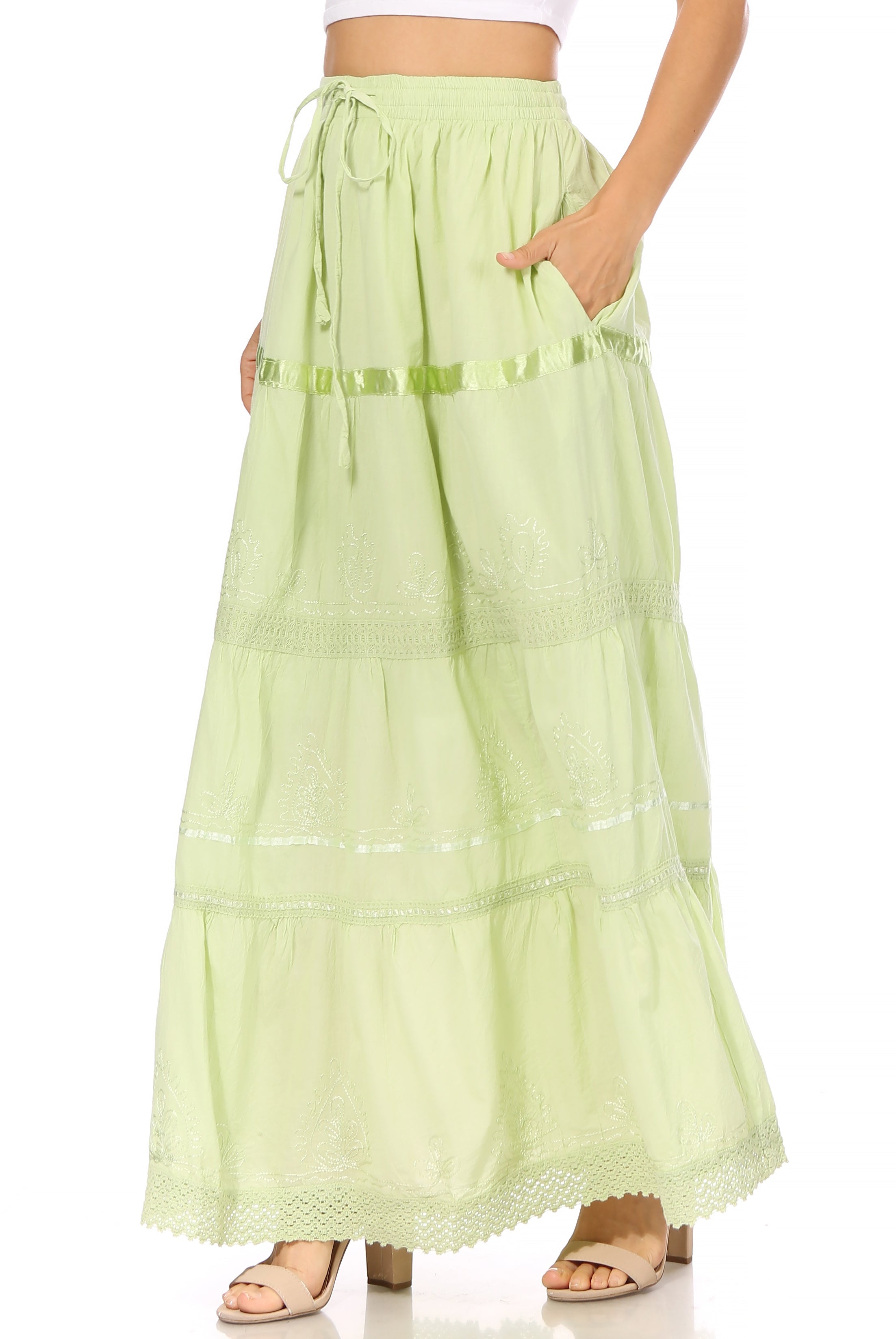 Light green skirt with ruffled details on a white background