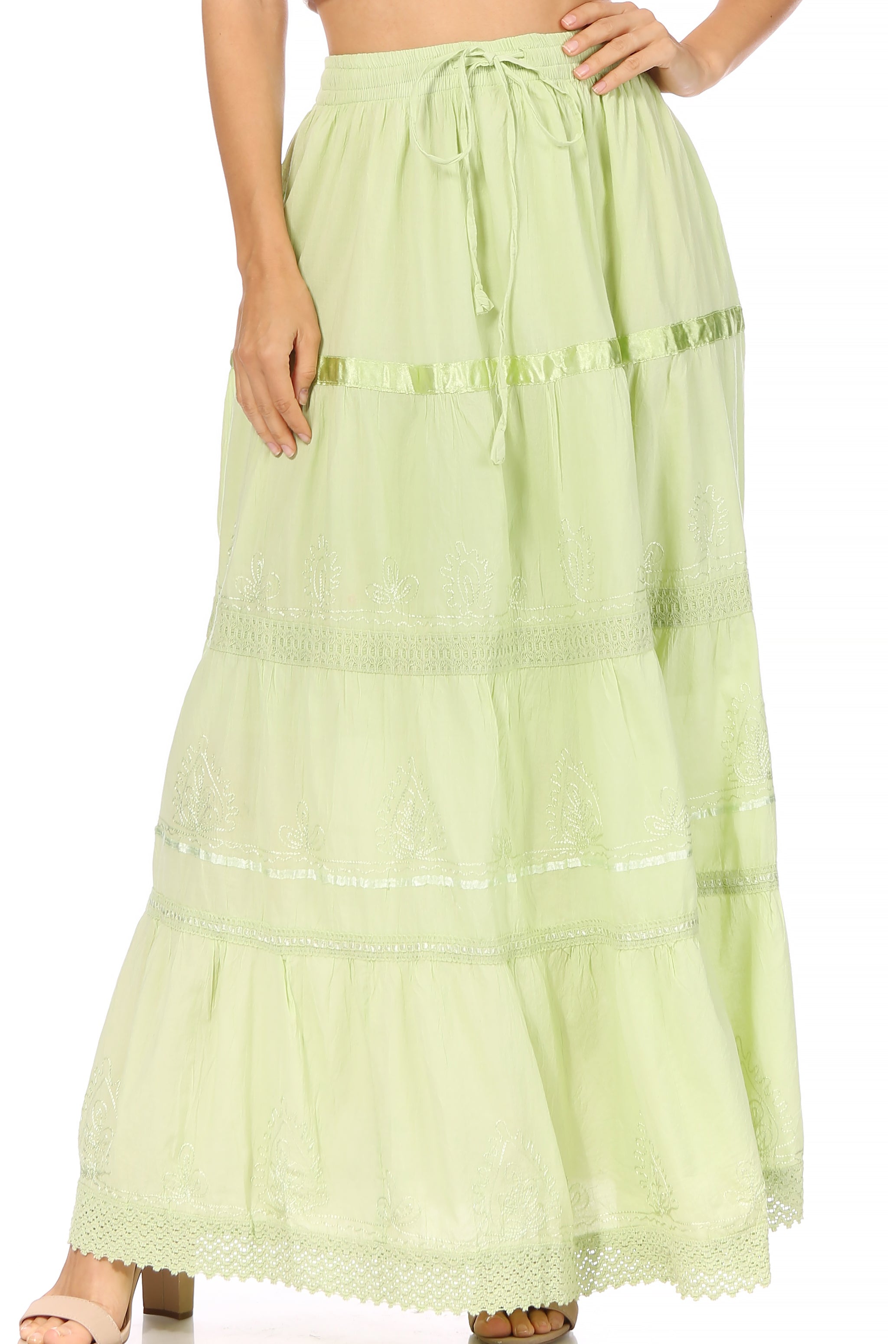 Light green skirt with lace details on a white background