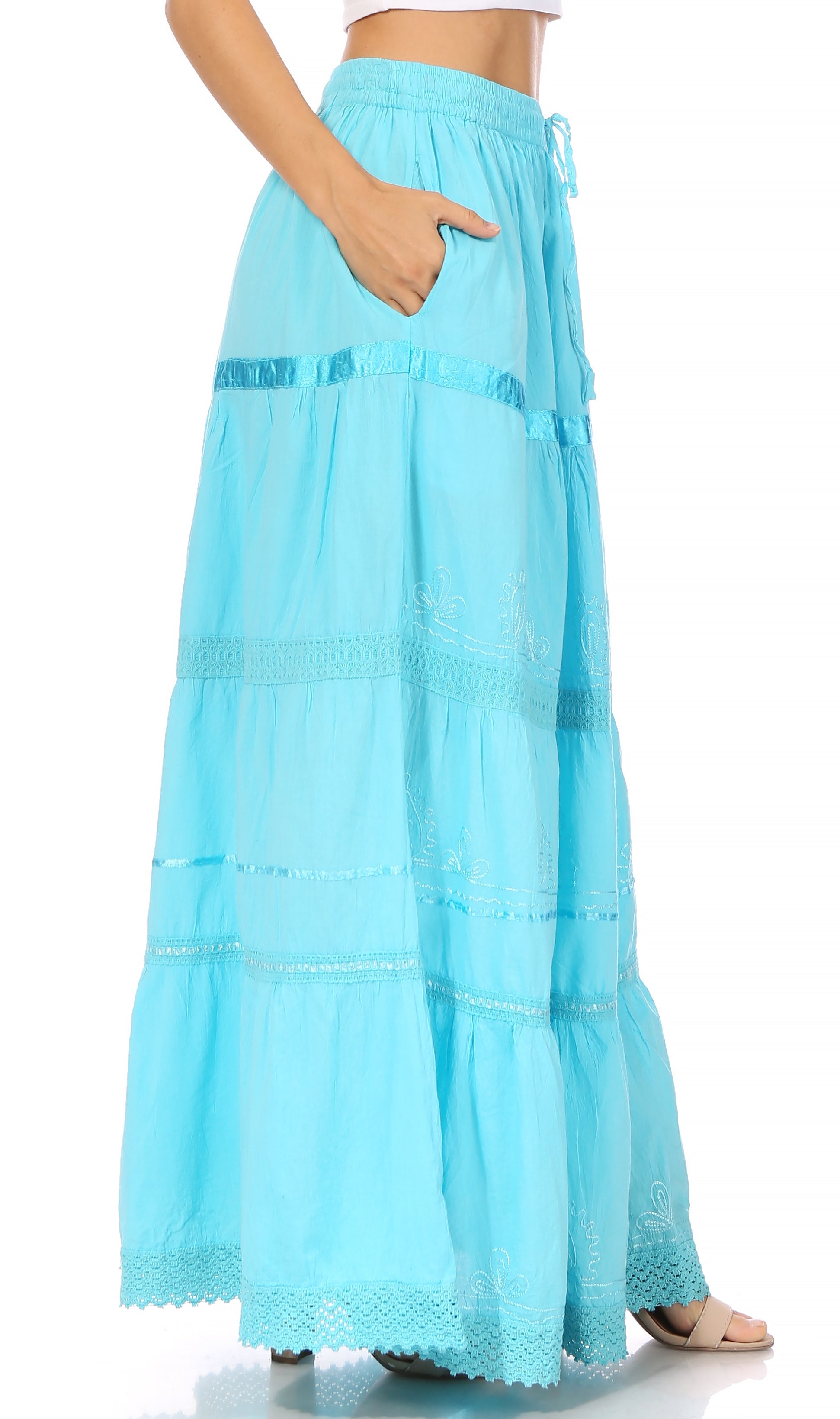 Light blue tiered skirt worn by a person on a white background