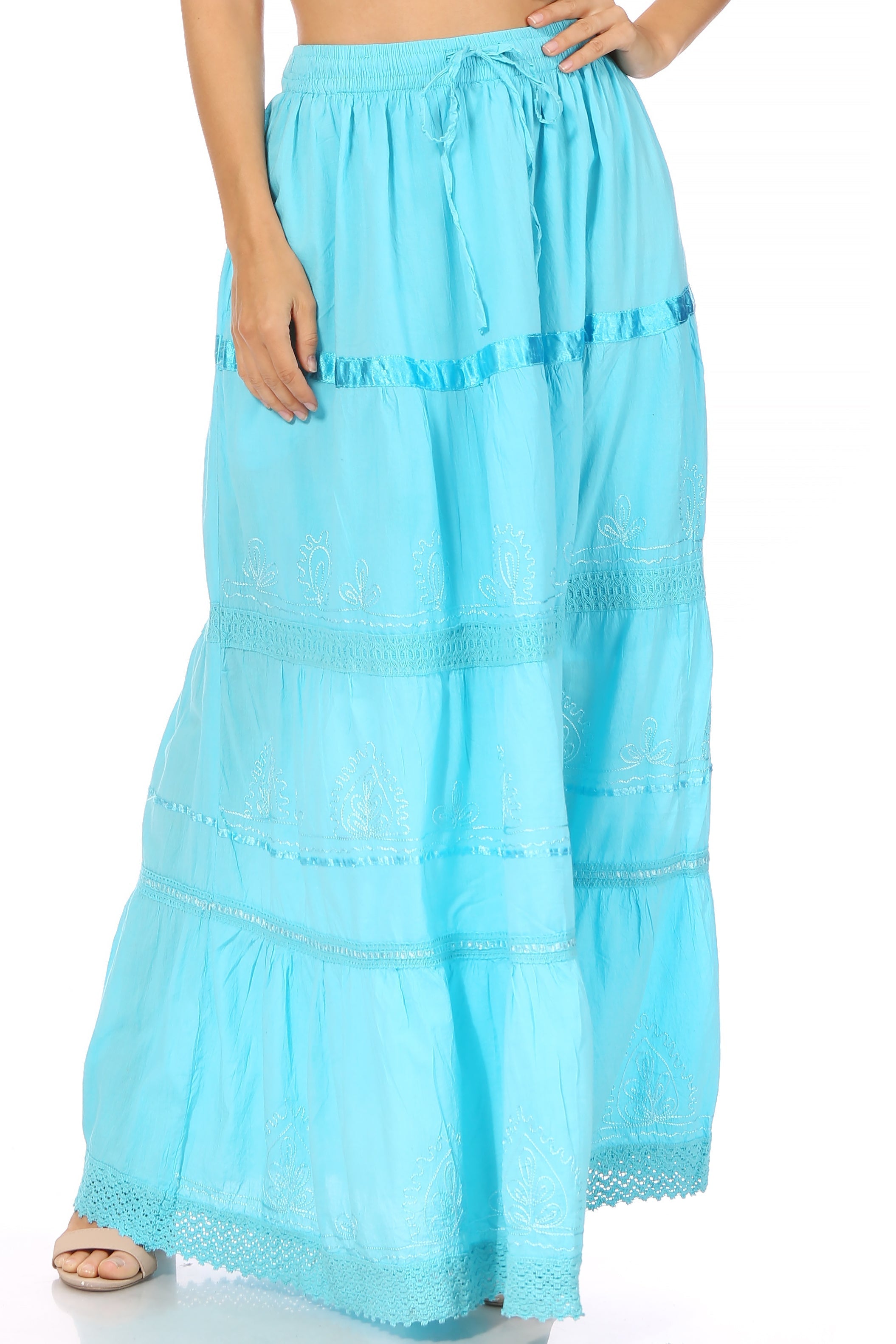 Light blue tiered skirt worn by a person on a white background