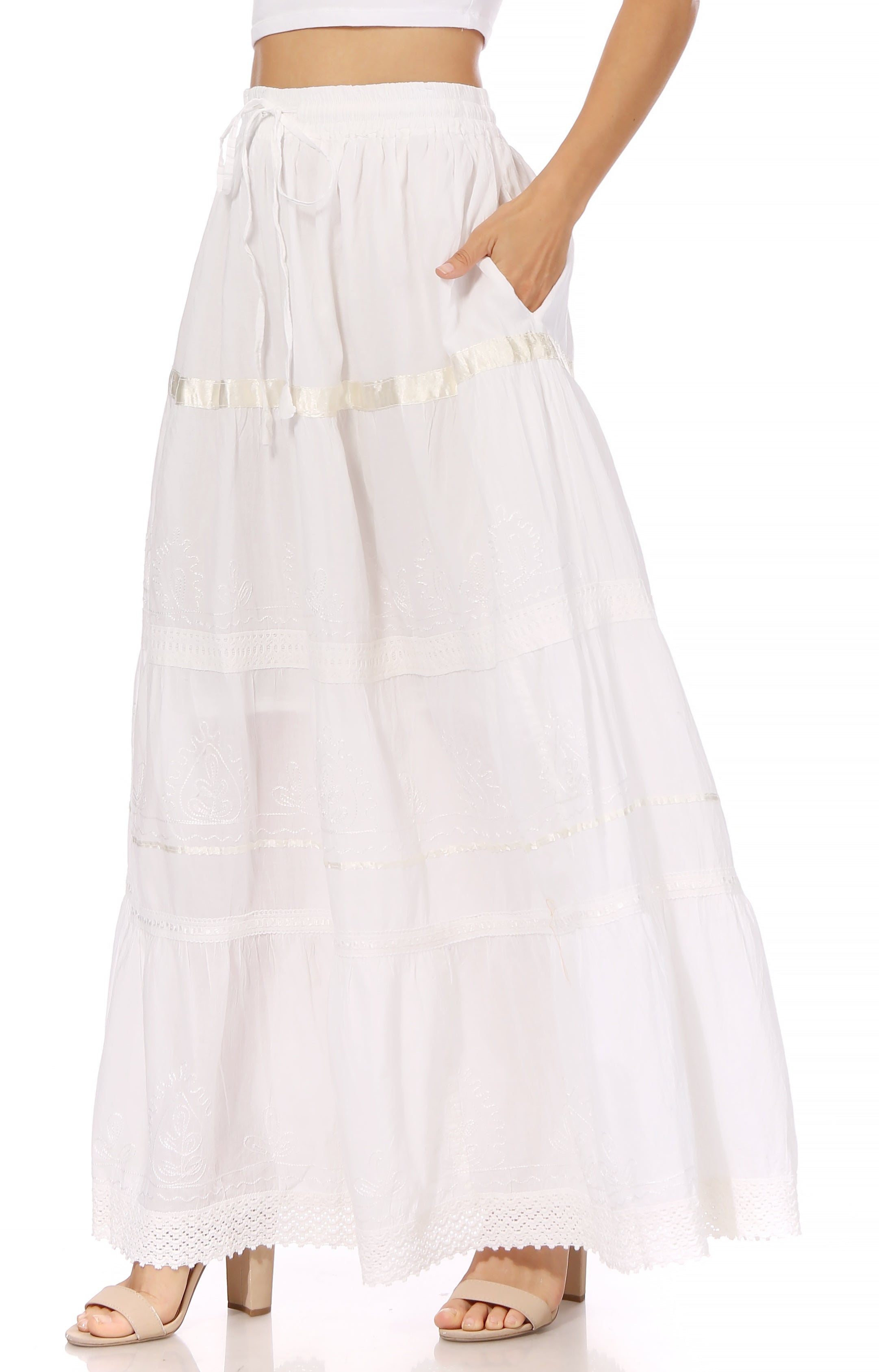 White wide-leg pants with gold accents on a white background
