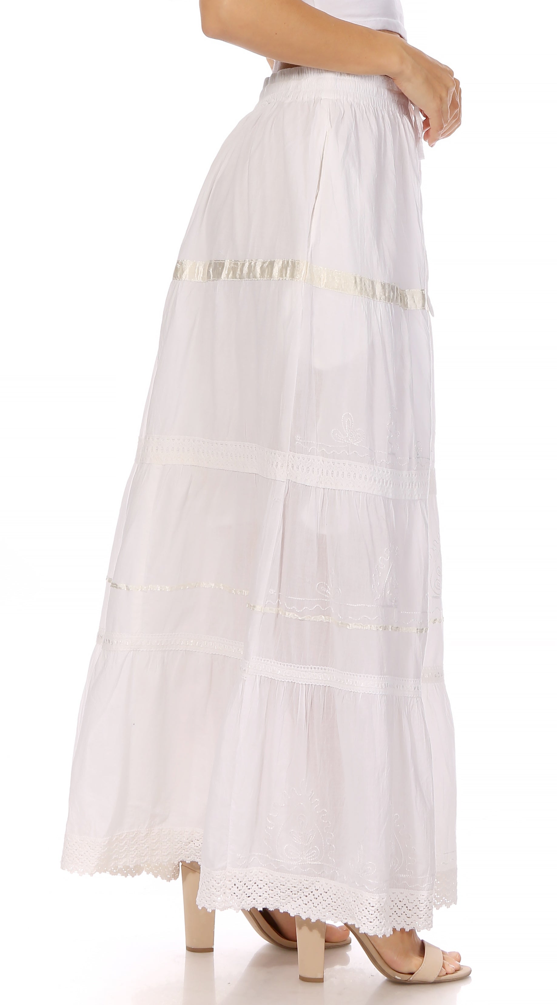 White long skirt with gold trim on a white background