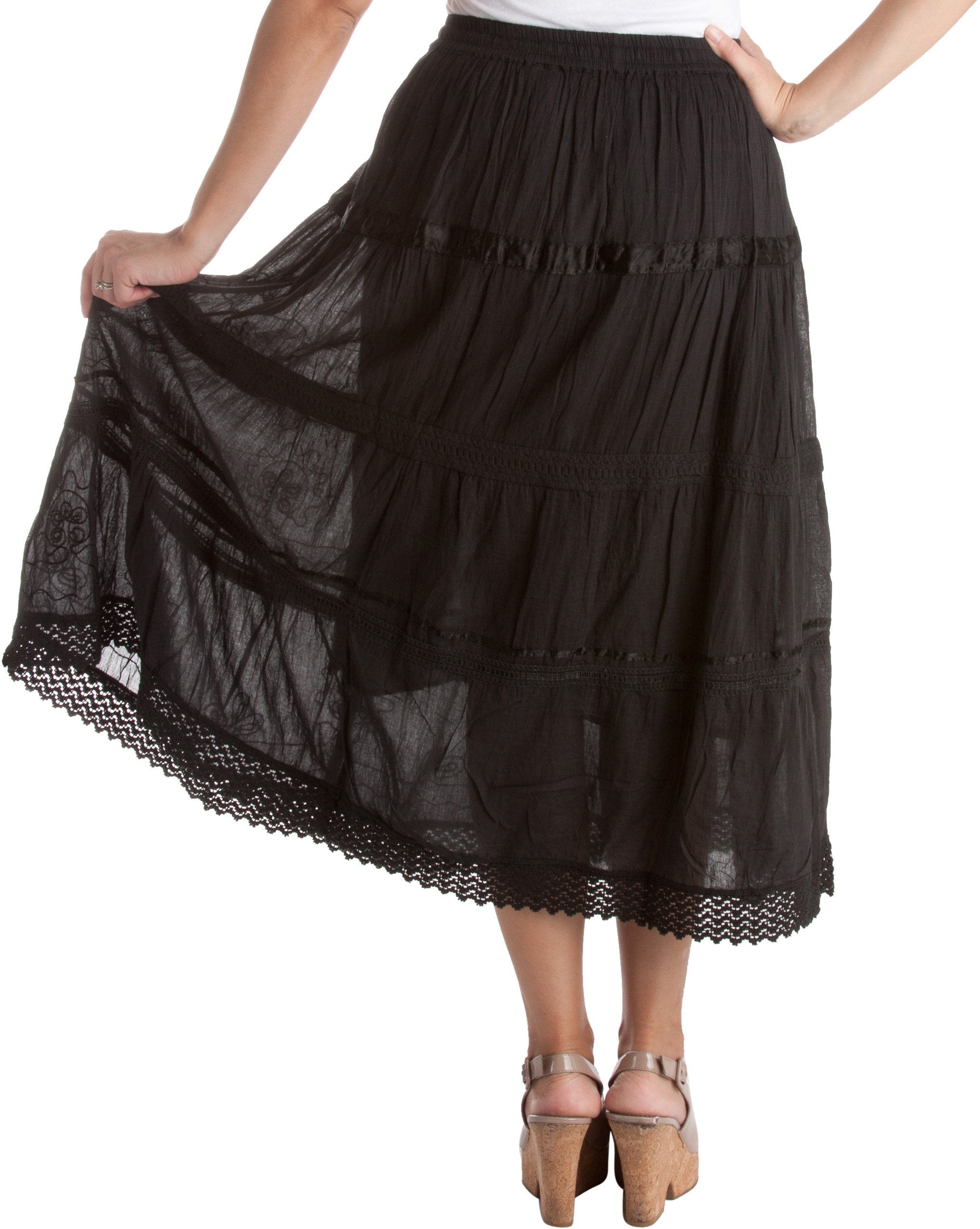 Black tiered skirt with lace details on a white background