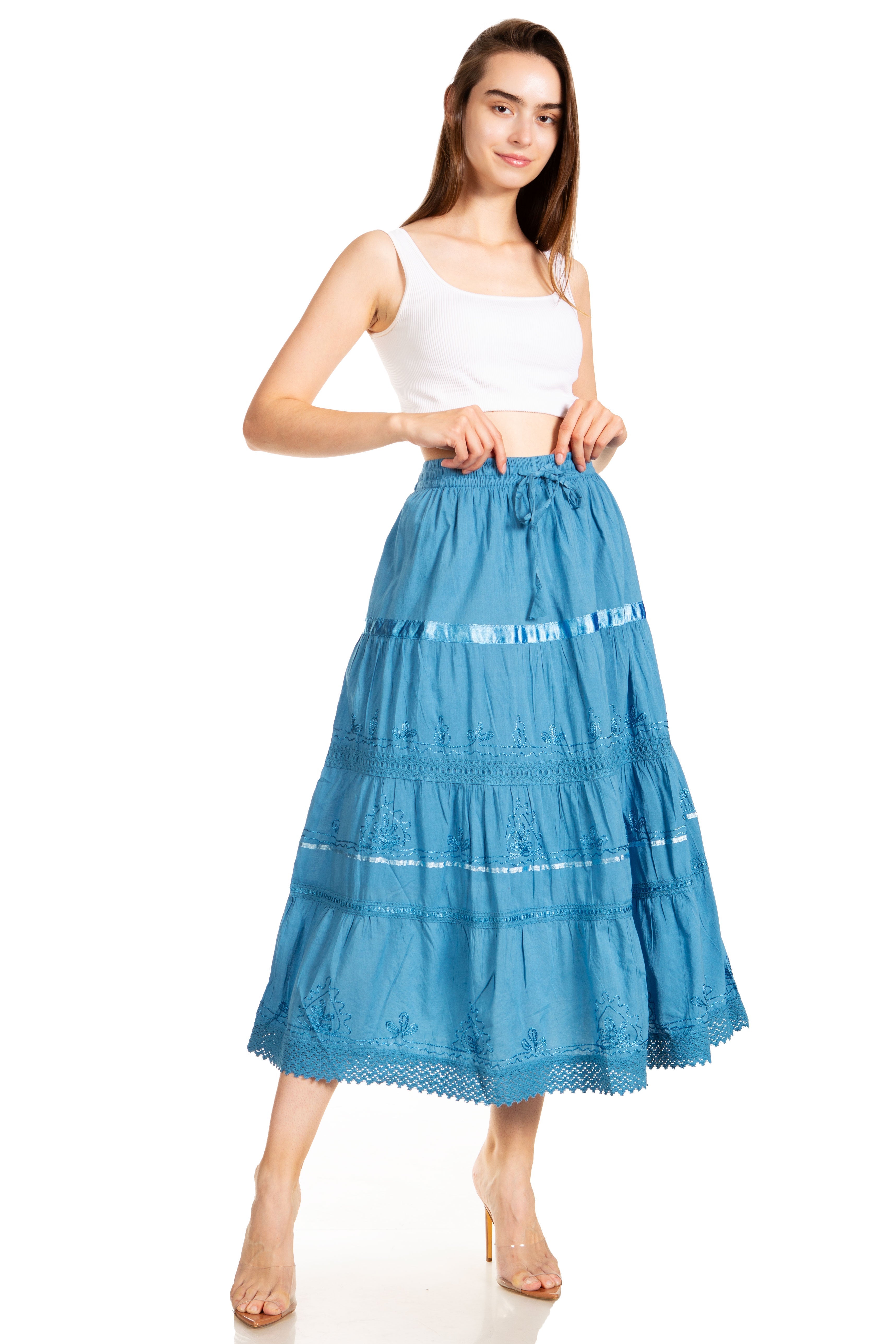 Woman wearing a blue tiered skirt on a white background