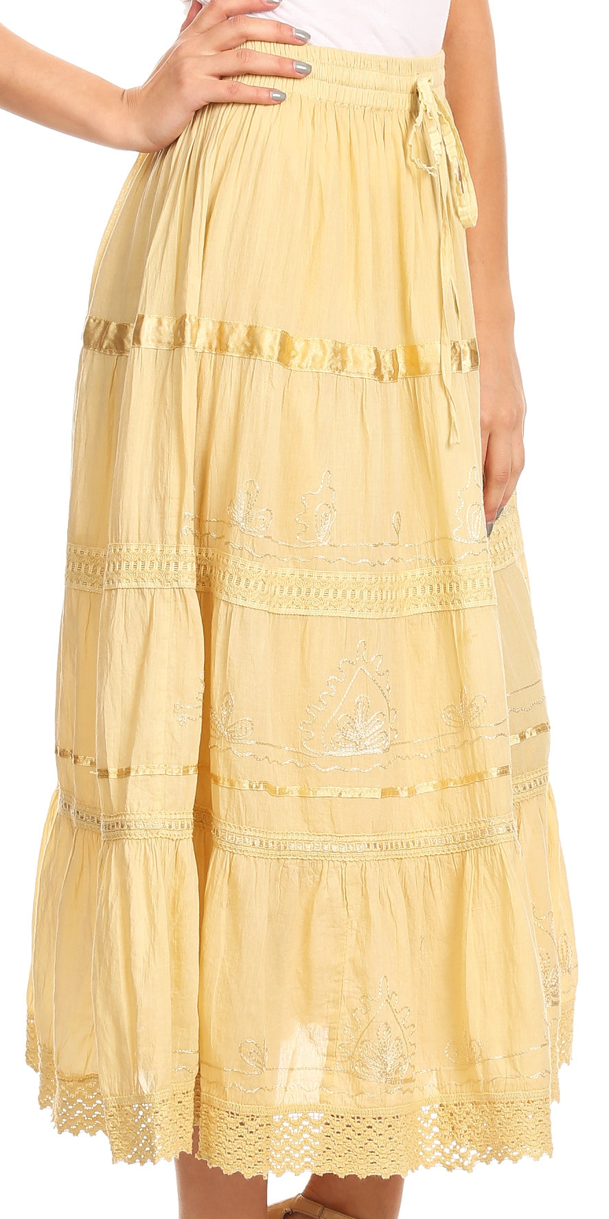 Yellow lace skirt worn by a person on a white background