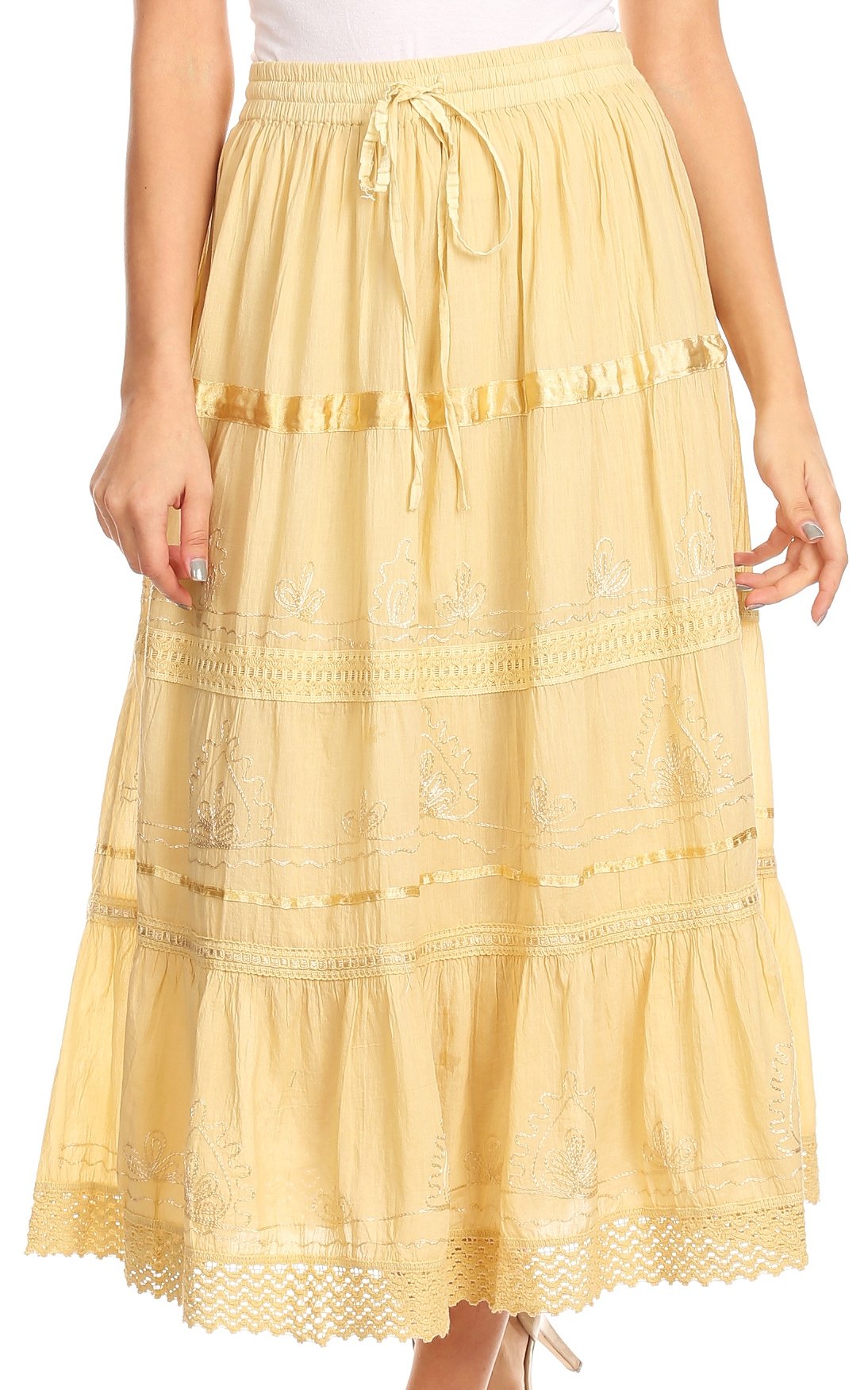 Yellow lace skirt worn by a person on a white background