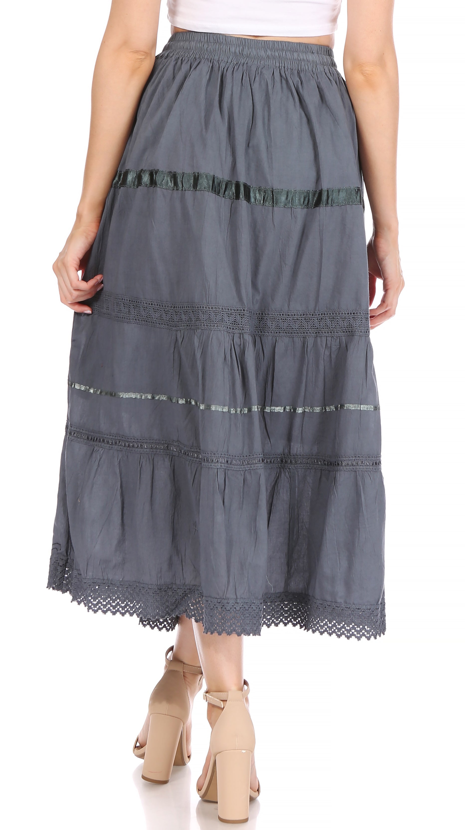 Long denim skirt with lace trim worn by a person on a white background