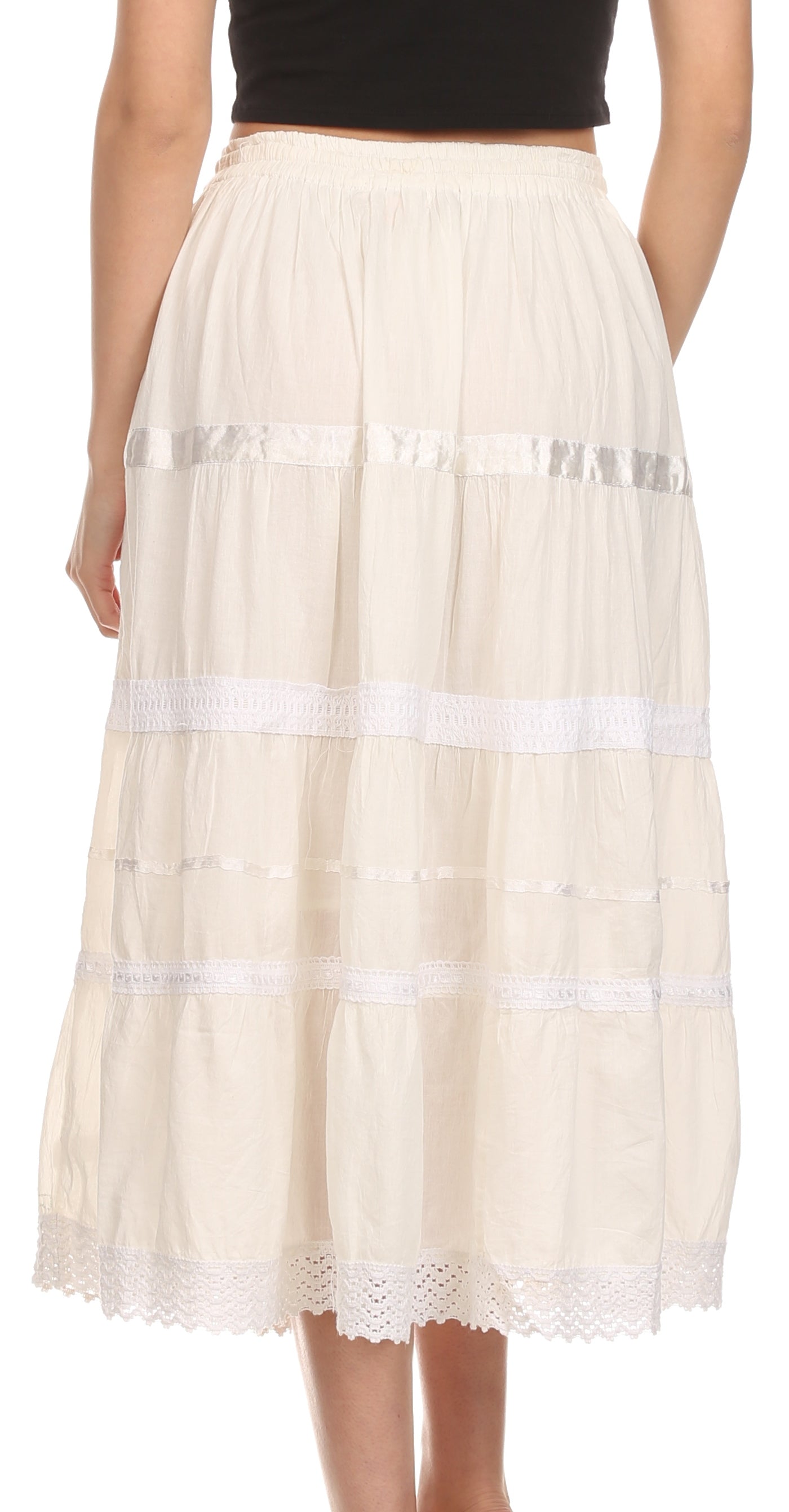 White lace skirt worn by a person on a white background