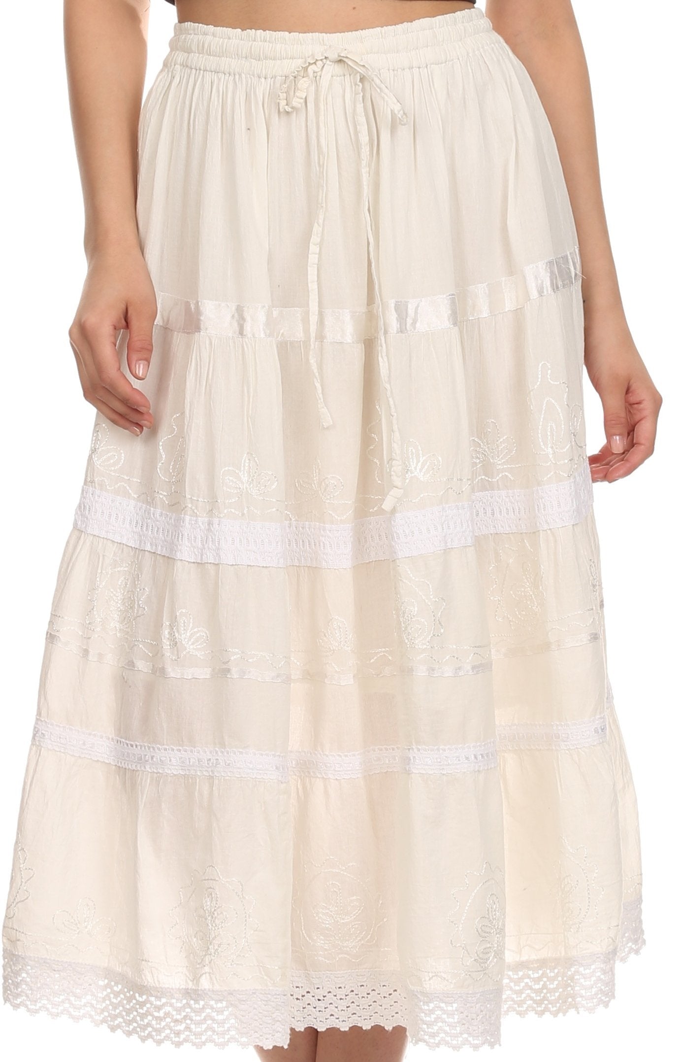 Beige skirt with white lace trim worn by a person on a plain background