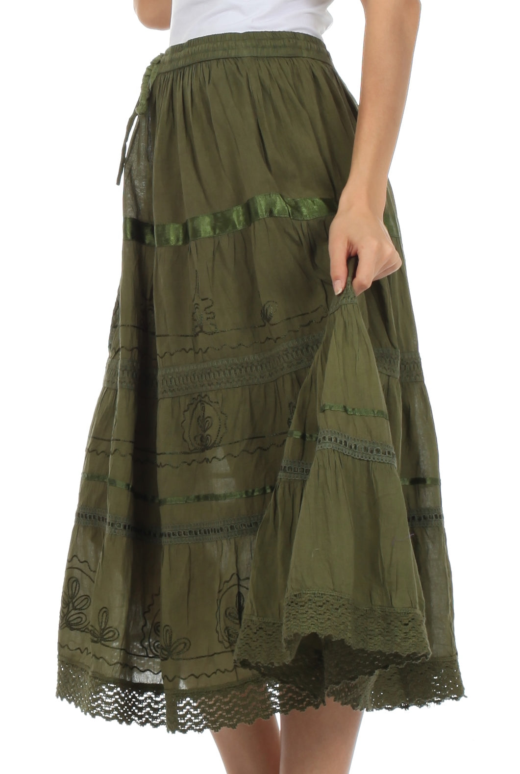Green embroidered skirt worn by a person on a white background