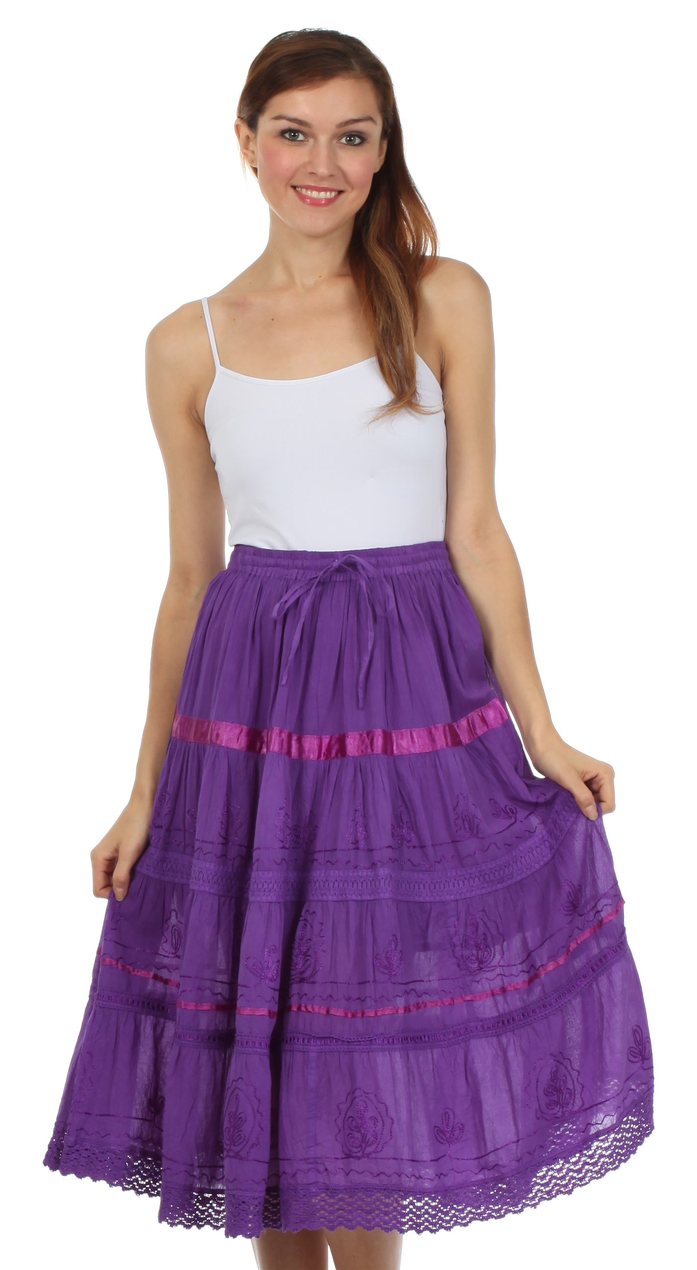 Woman wearing a white top and purple skirt with pink accents on a white background
