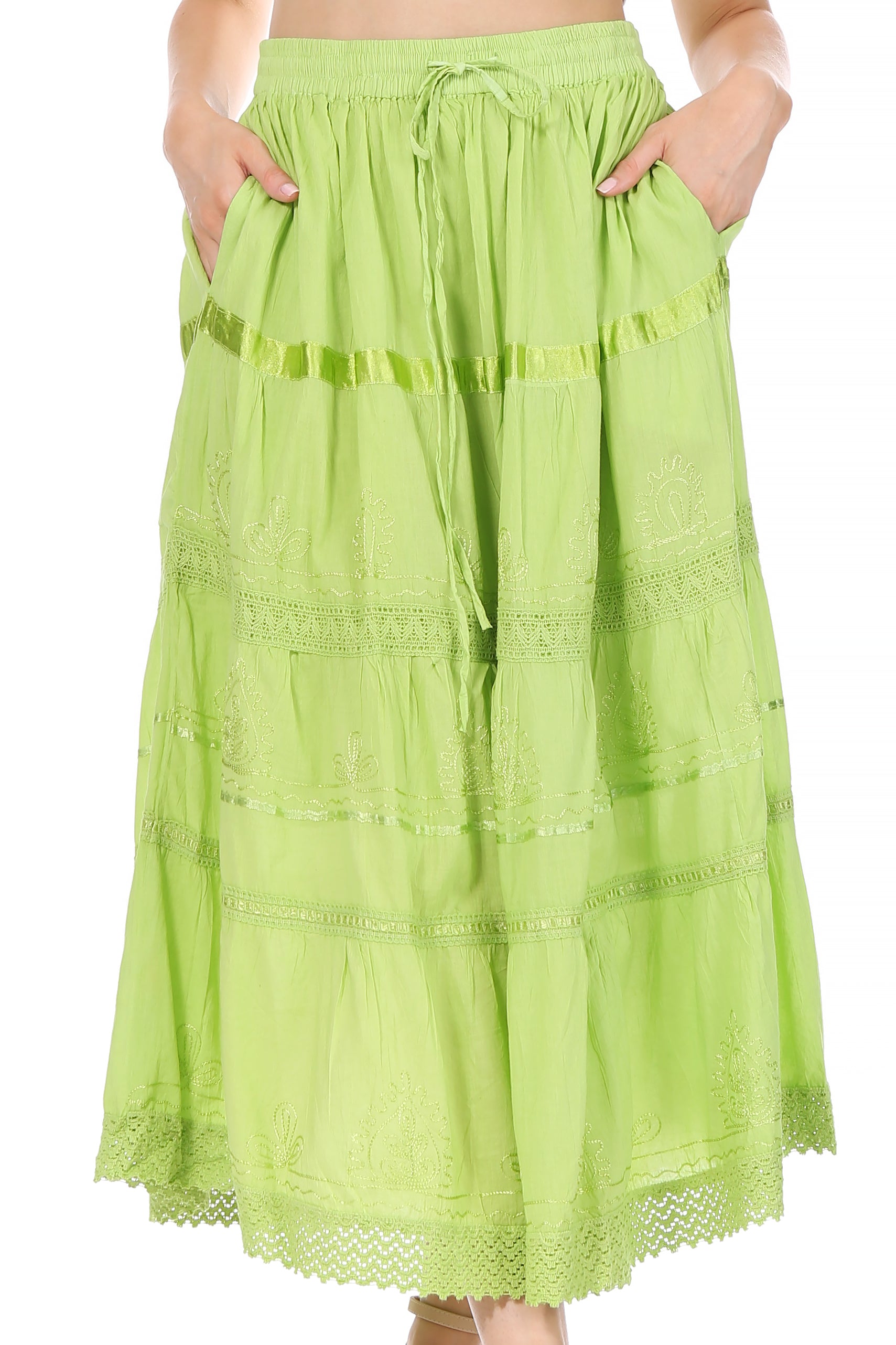 Green lace skirt worn by a person on a white background