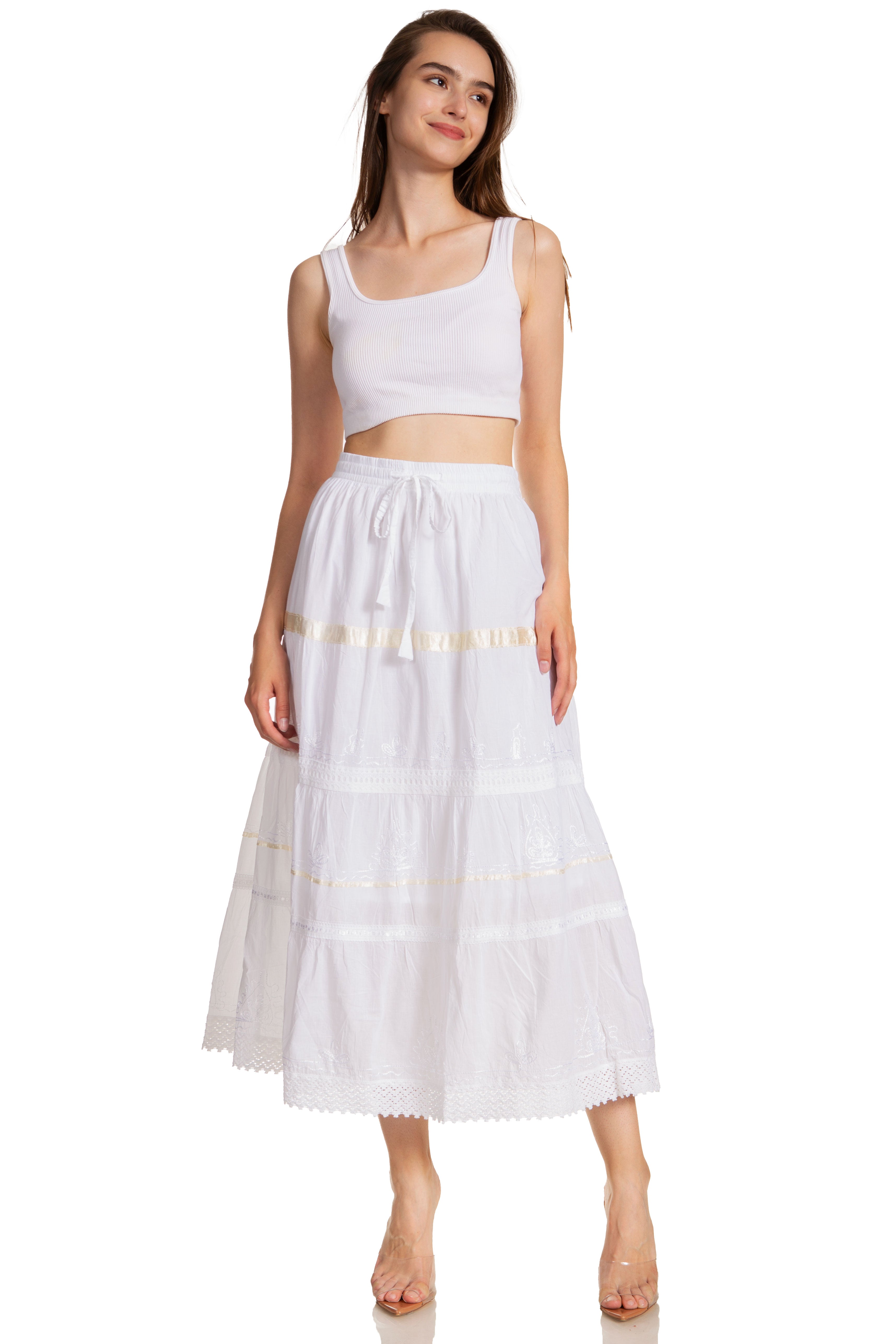 Woman wearing a white sleeveless top and skirt on a white background