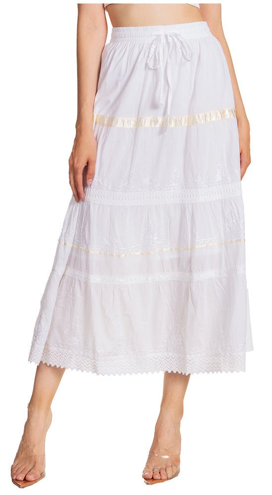 White skirt with gold trim worn by a person on a white background