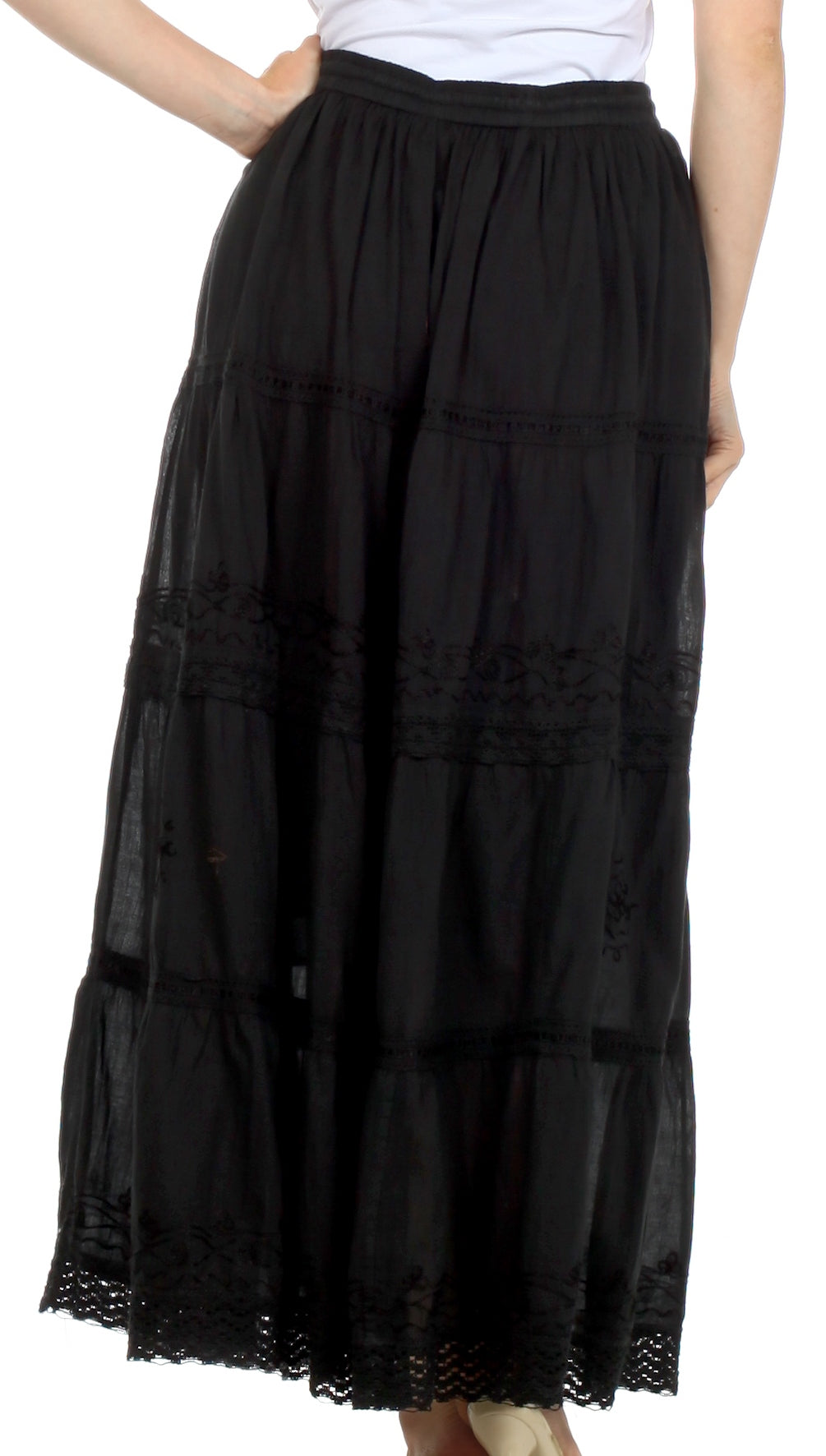 Black layered skirt worn by a person on a white background