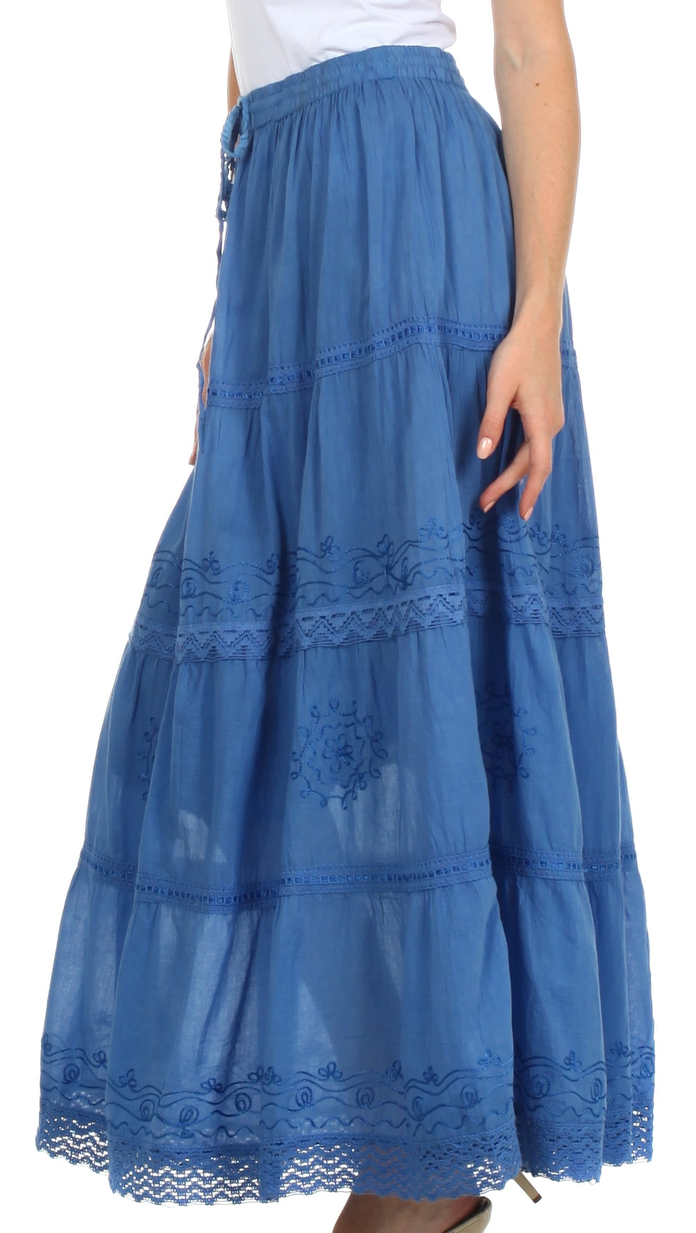 Blue embroidered skirt worn by a person on a white background
