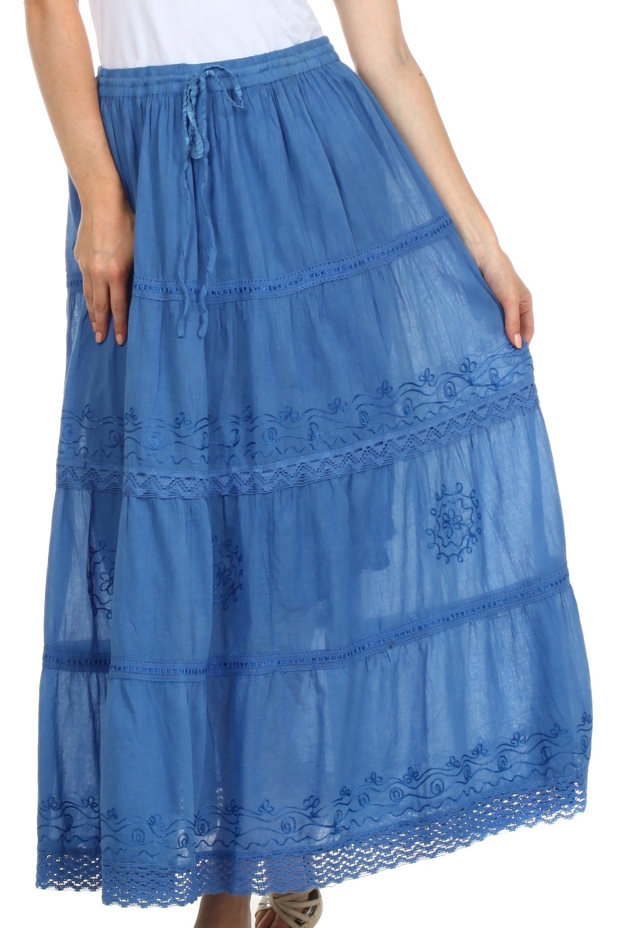 Blue lace skirt worn by a person on a white background