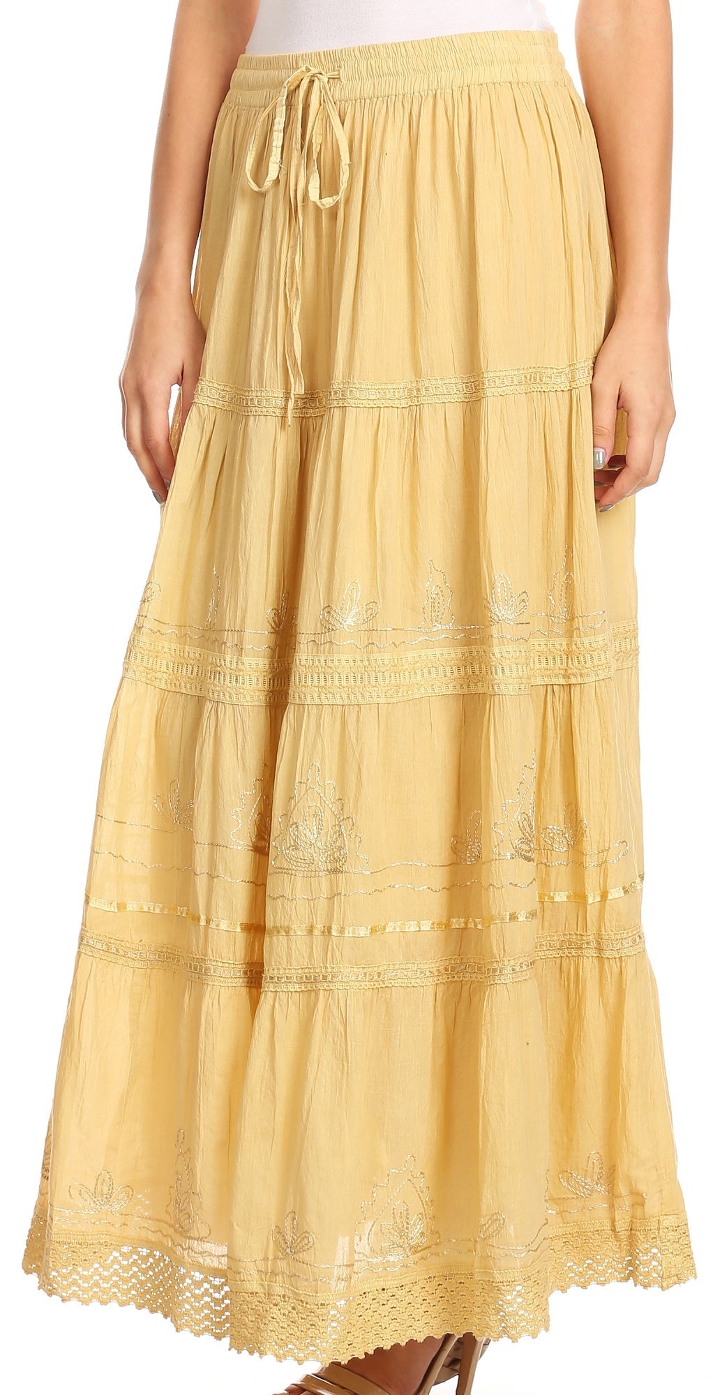 Yellow tiered skirt with lace details on a white background