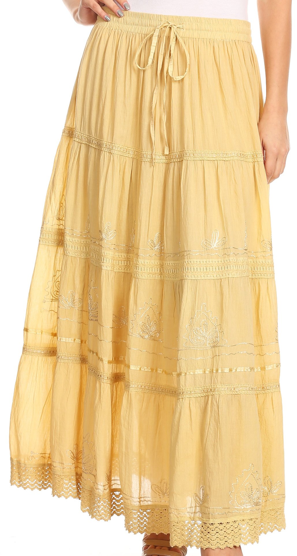 Yellow lace skirt worn by a person on a white background