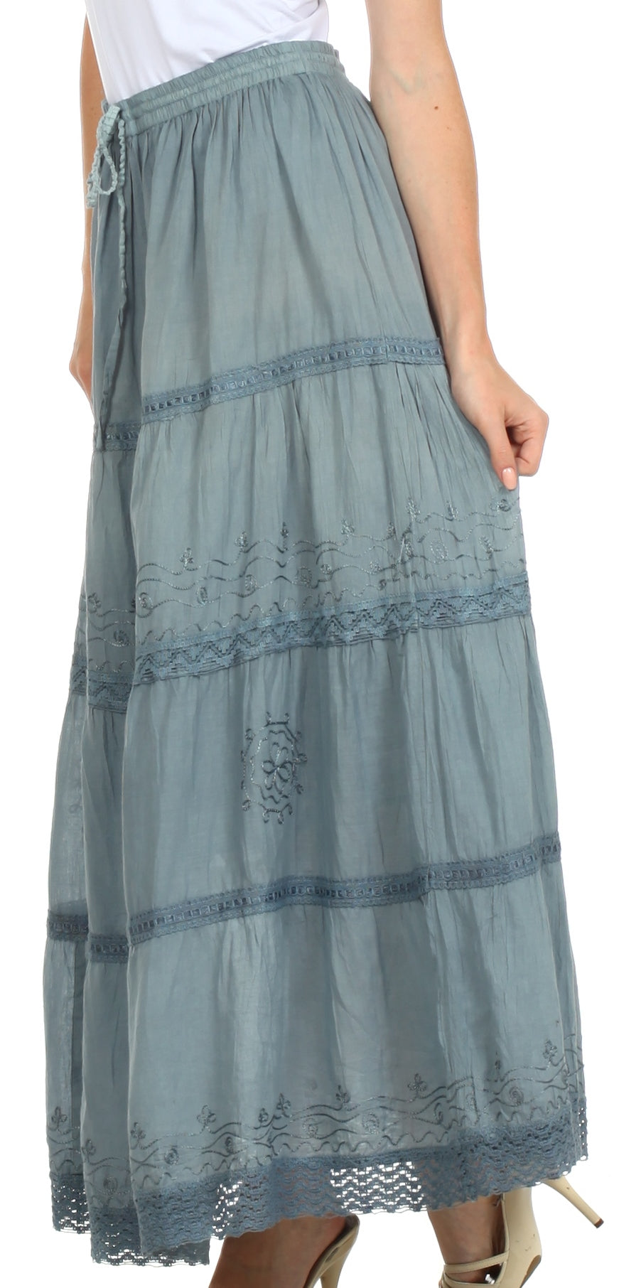 Long green skirt with lace details on a white background