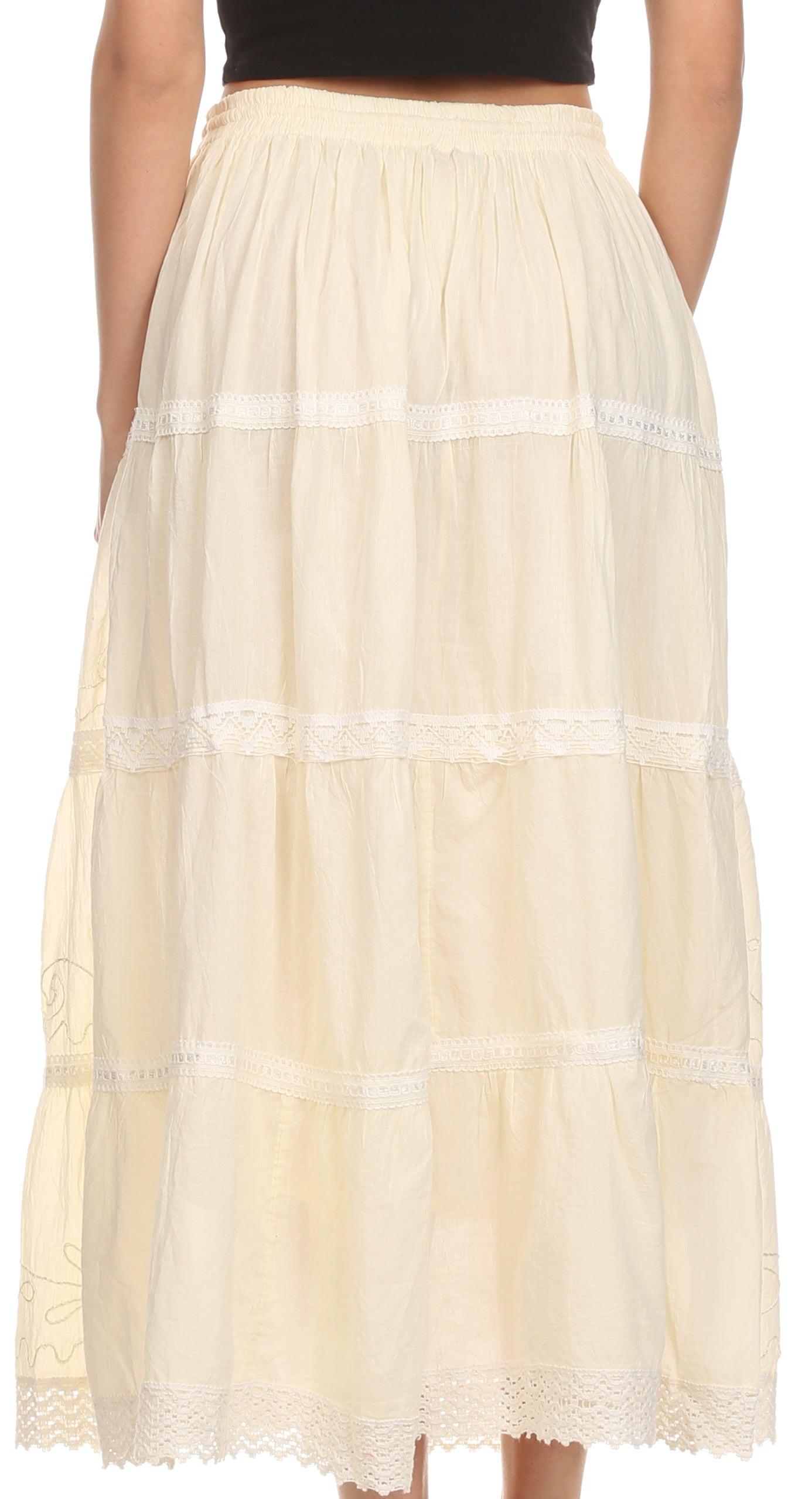 Beige tiered skirt worn by a person on a white background
