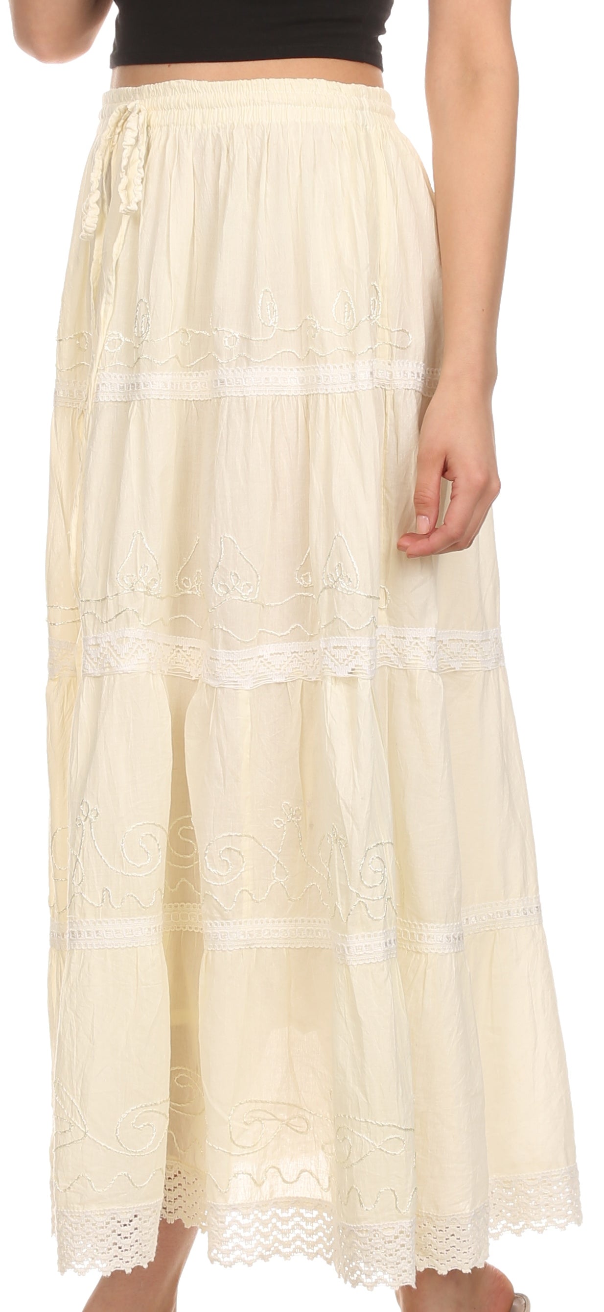 Beige lace skirt worn by a person on a white background