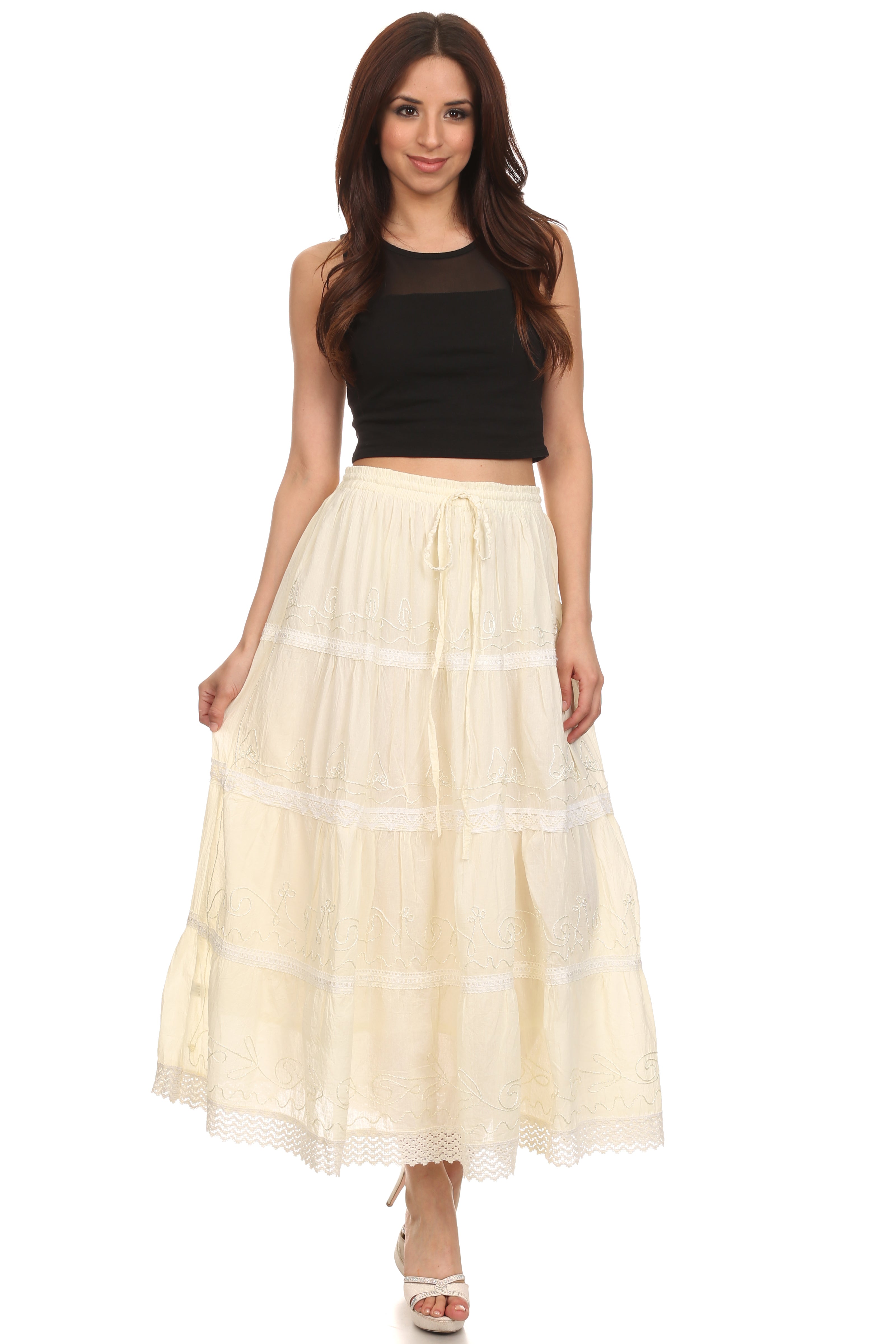 Woman wearing a black top and beige skirt on a white background