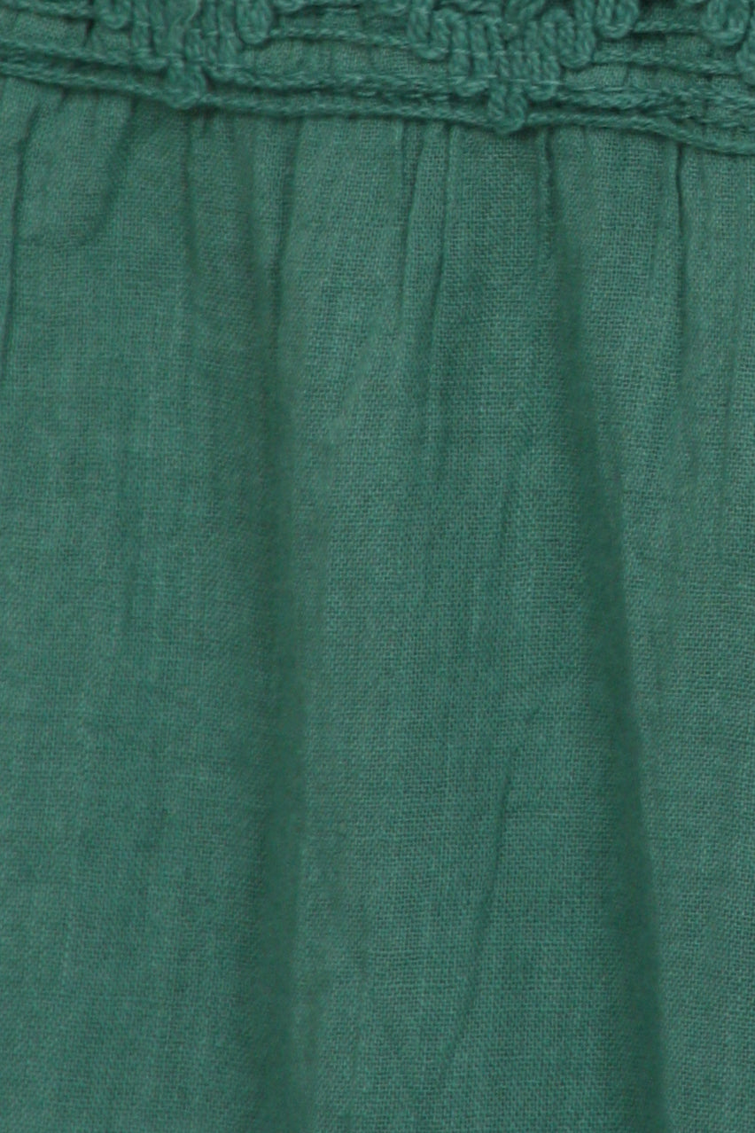 Close-up of a green fabric with textured top edge