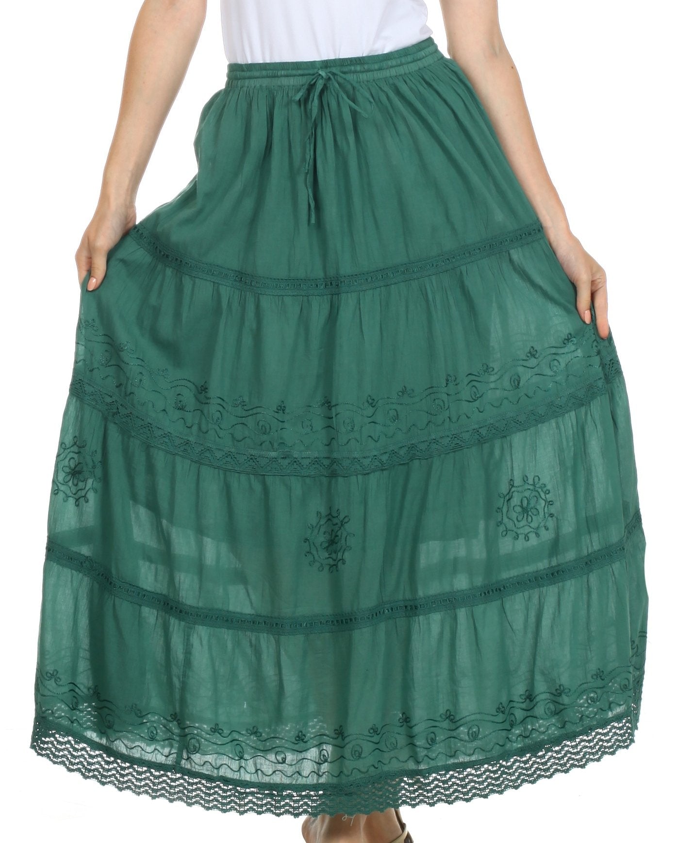 Green lace skirt worn by a person on a white background